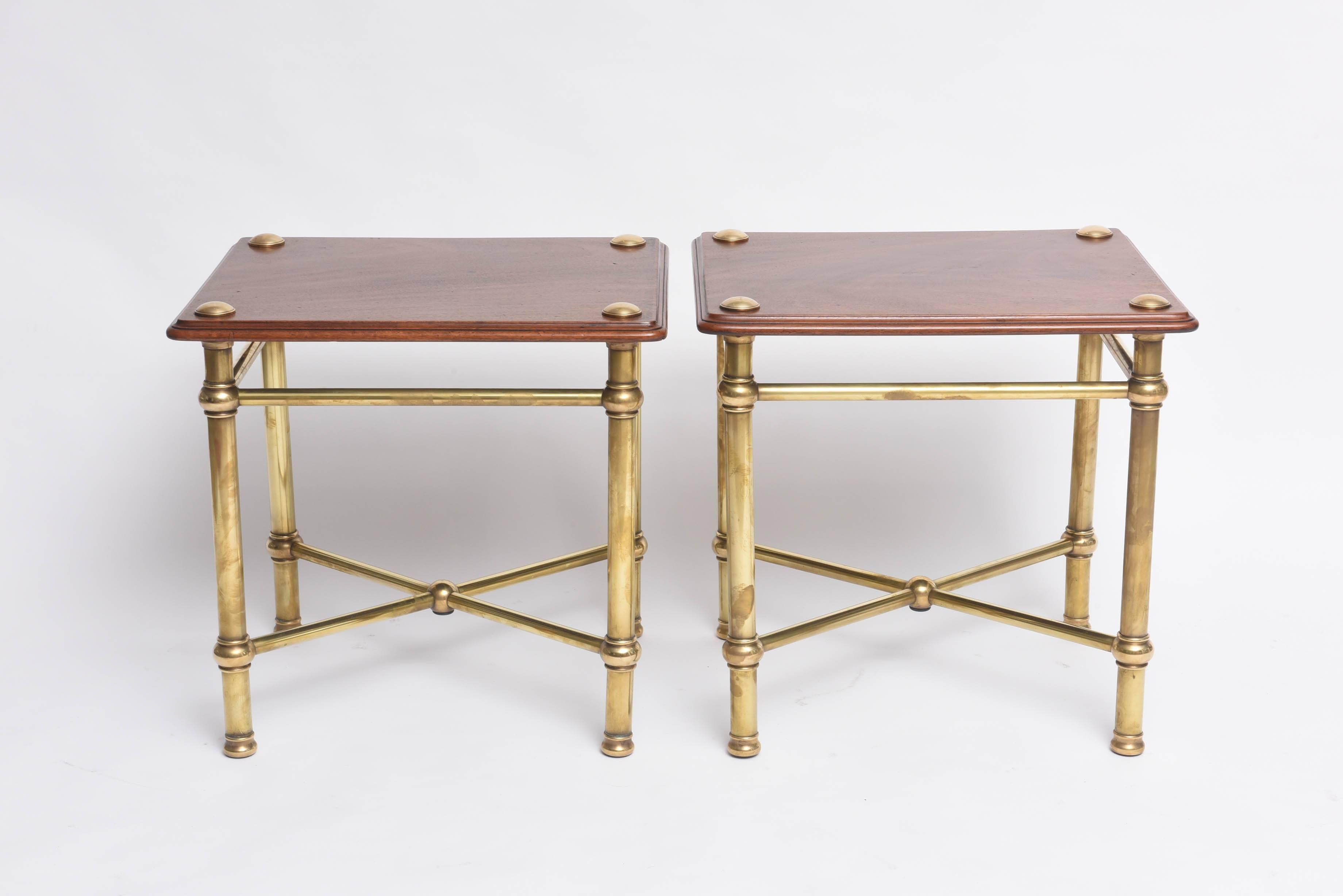 This rare pair of side tables were purchased in London and make for the ideal sized side tables. The have a great look with their tubular framed legs and cross-stretchers. The wooden tops are mahogany which has mellowed to an incredible