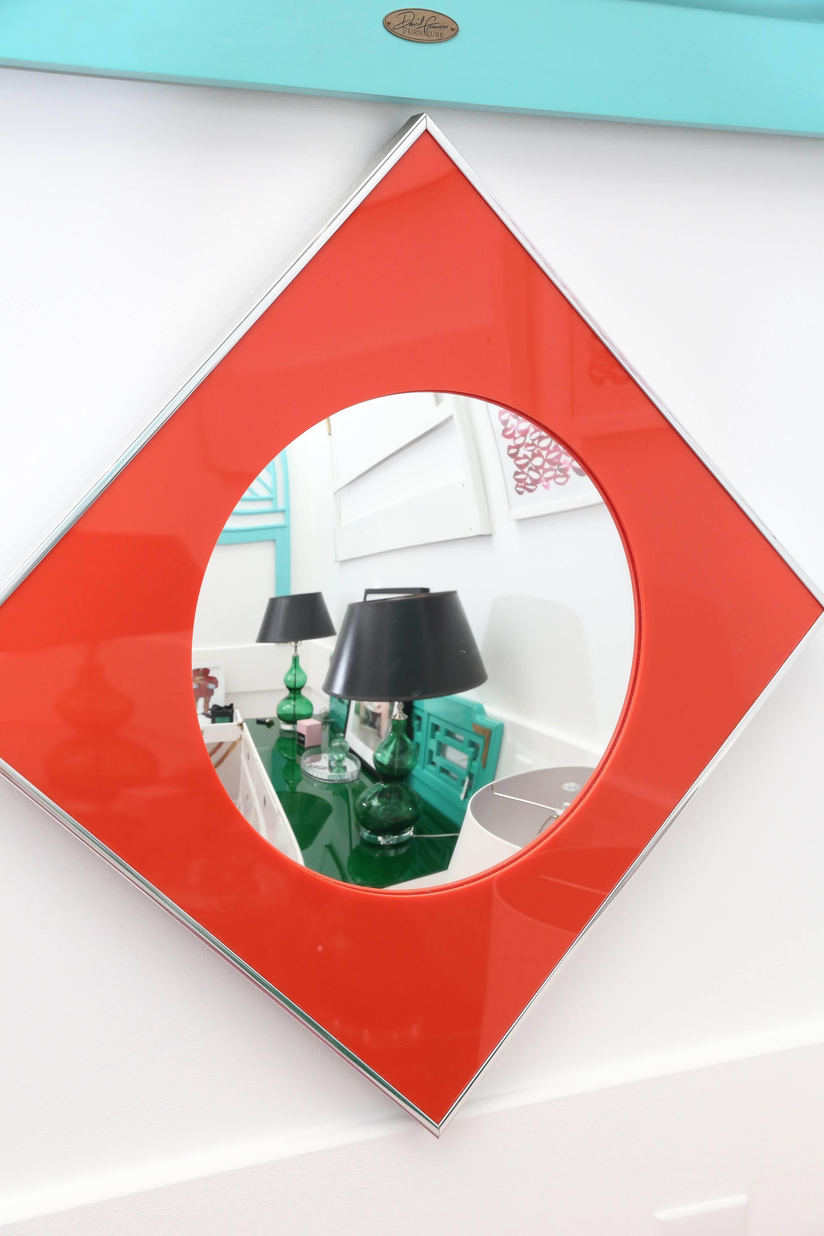 Offered is a carvers guild convex red Lucite and chrome mirror. This mod mirror would look great in a powder bath, dressing room or mod bedroom.