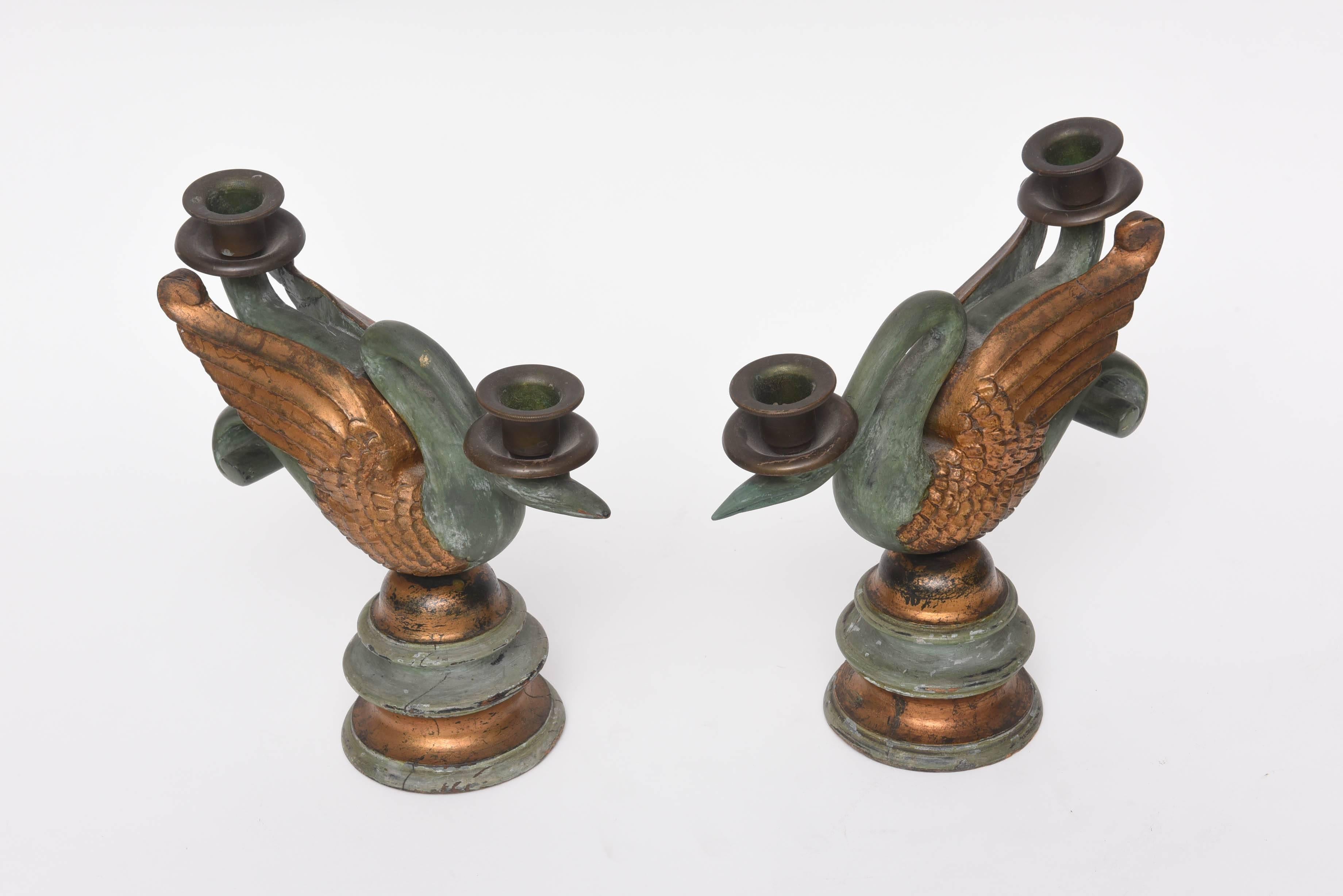 Very sweet pair of hand carved swan candlesticks with original teal paint and gilding.