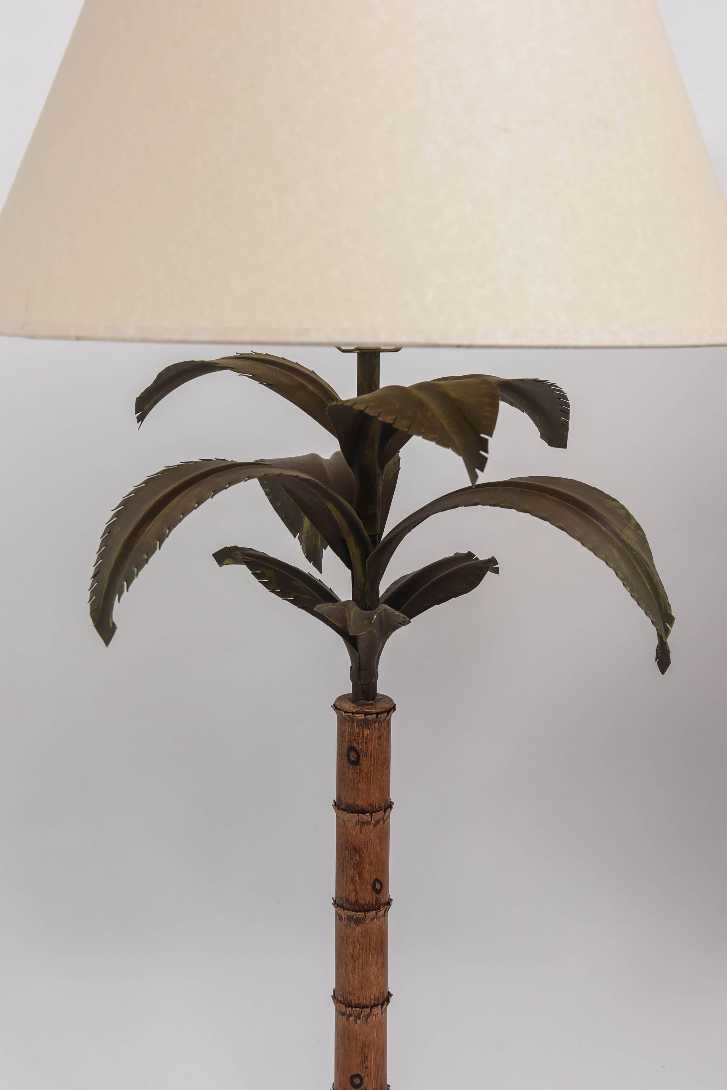 Pair of Palm Beach Regency tole lamps in the form of palm trees with original paint.