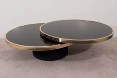 Black Glass and Brass Swivel Cocktail Table by the Design Institute of America