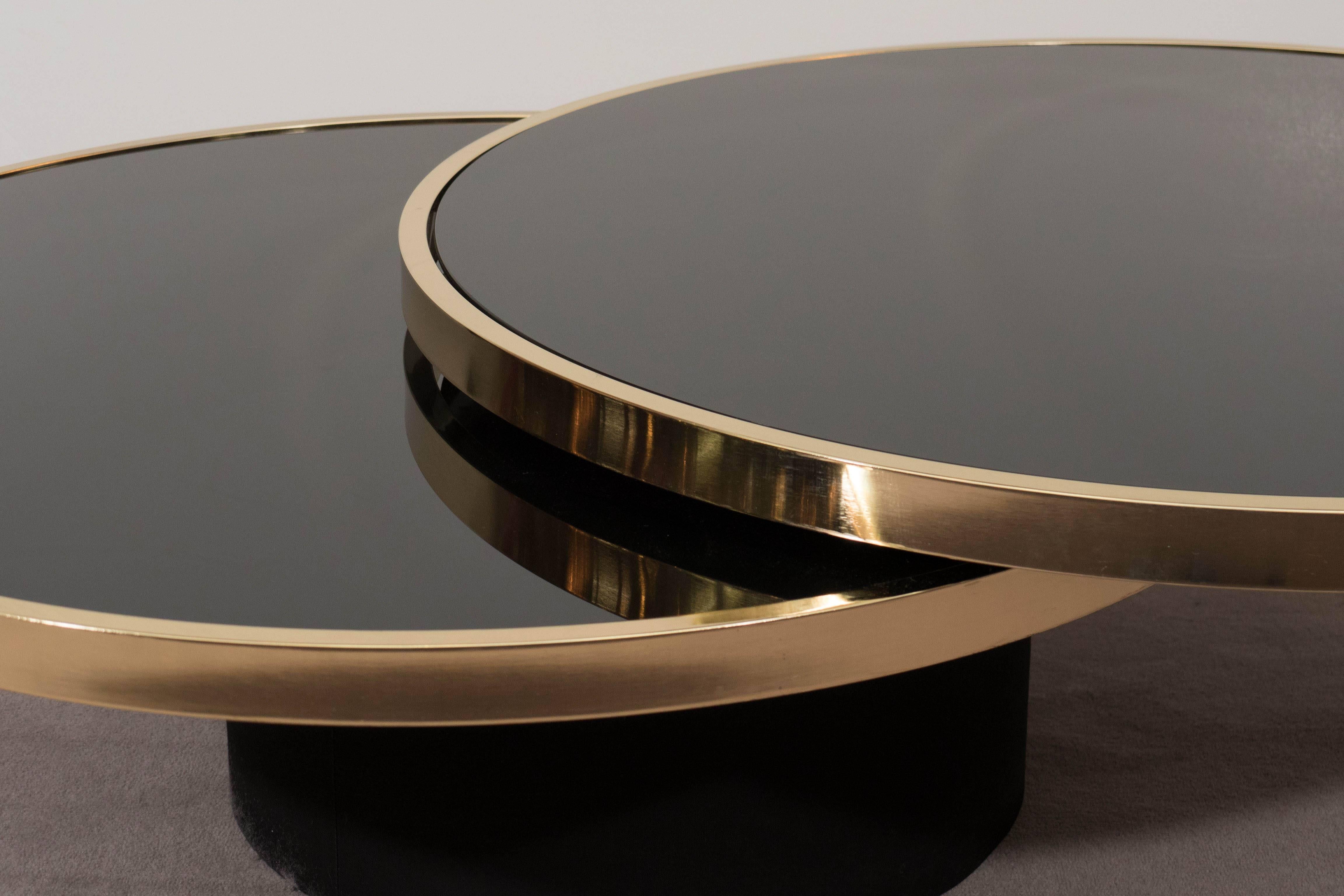 Modern Black Glass and Brass Swivel Cocktail Table by the Design Institute of America