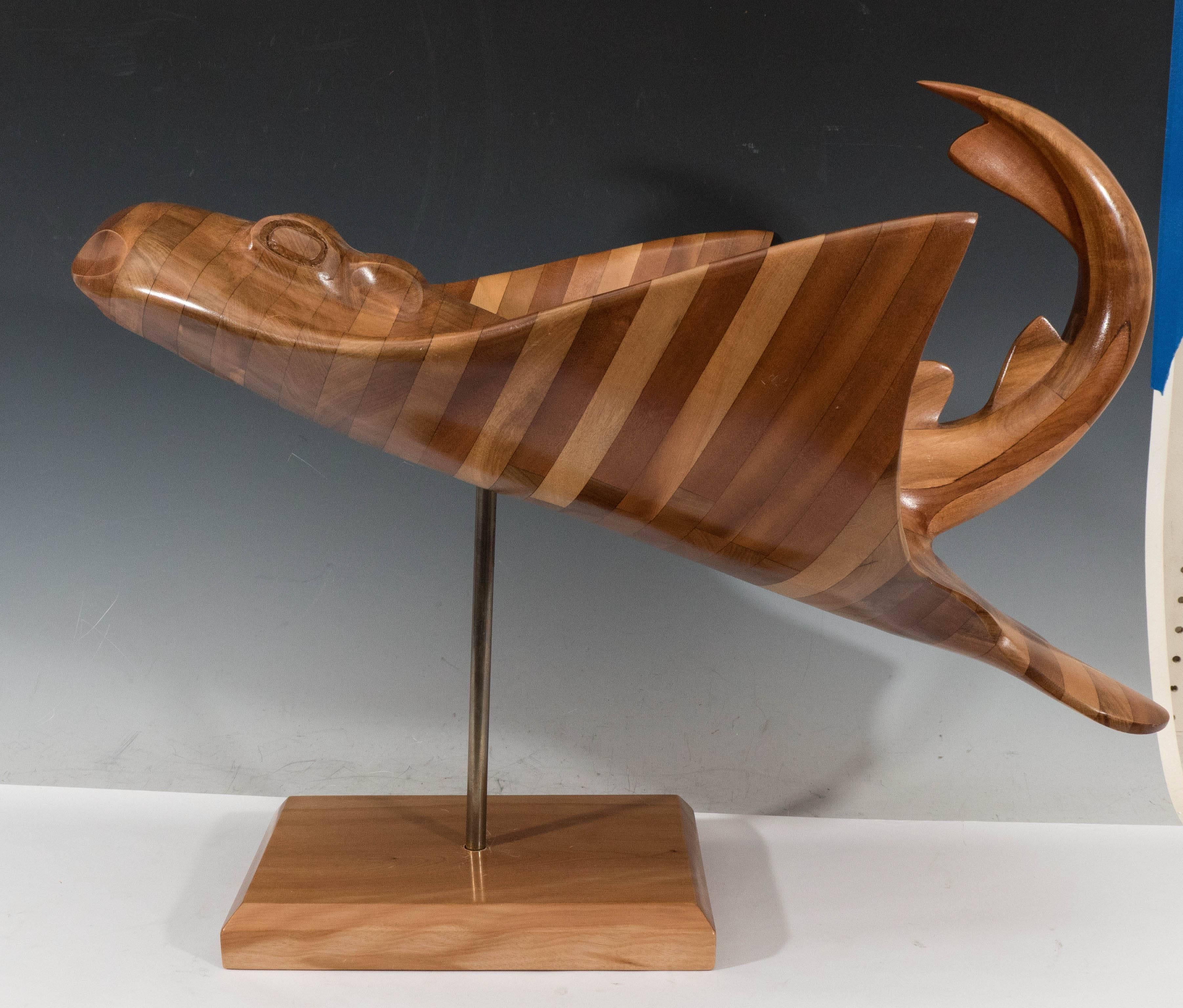 This sculptural ray by French born artist Polyte Solet (b. 1943), produced within the early 2000s, comes in molded Chilean wood, supported on a square base. Markings include a plaque, signed and dated by the artist, to the underside of each base.