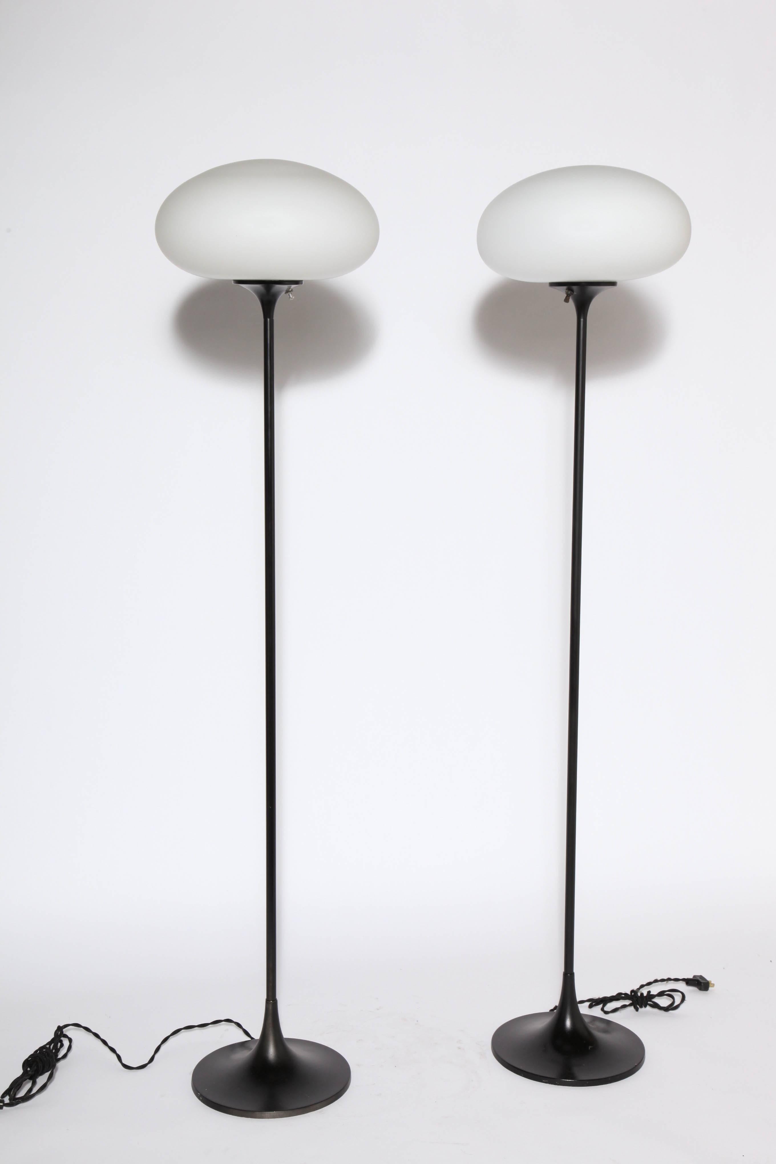 Pair of Bill Curry Mushroom Series Floor Lamps by Design Line Segundo, California, circa 1960. Featuring Black enameled metal tubular stems, round 10D tulip bases and White Frosted Glass Globes. Balanced. Sculptural. California Modern. Rarity.