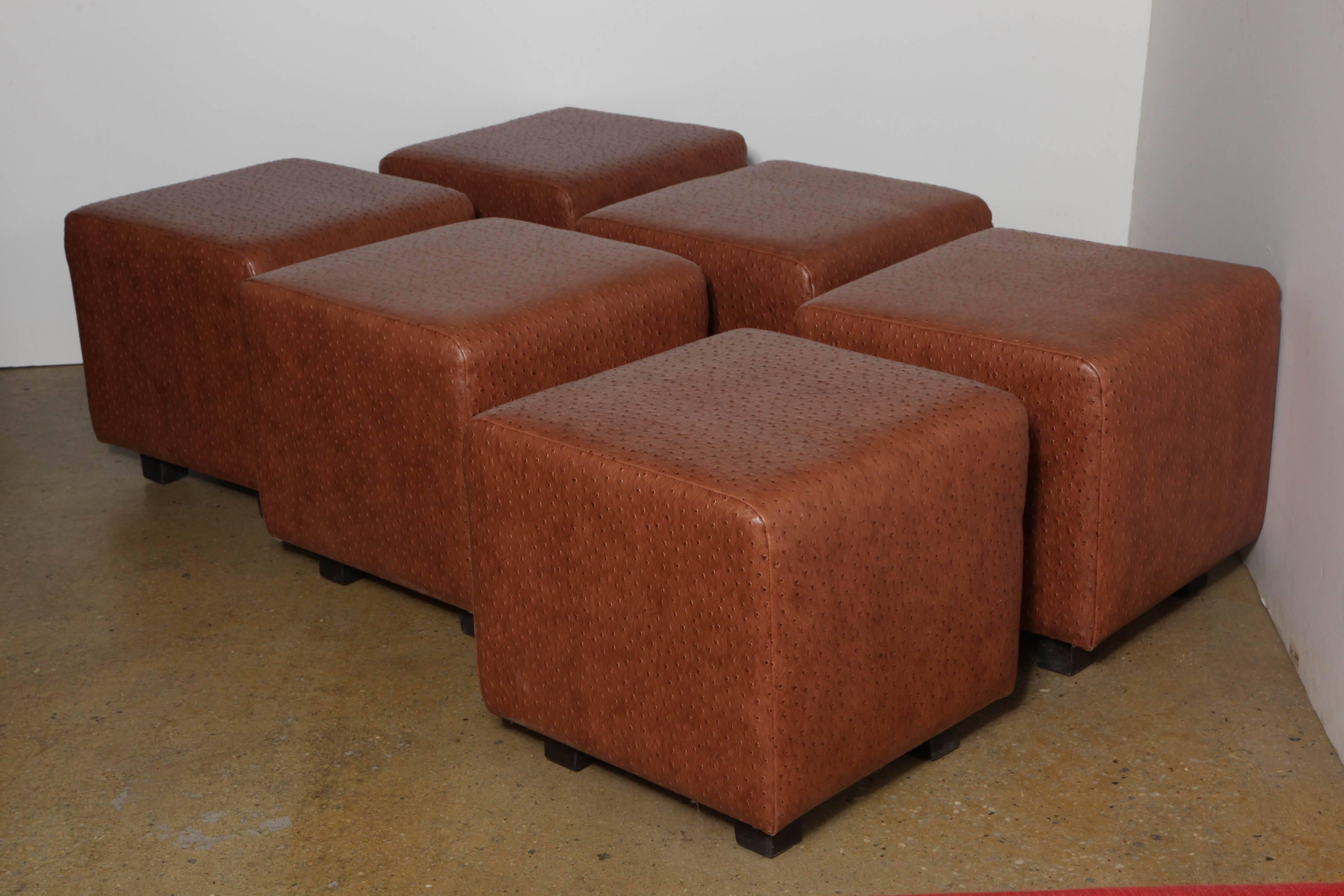 Five custom made comfortable 1980s, new old stock, American Modern faux Ostrich wrapped Stools in the style of Jean Michel Frank.  Originally commissioned for upscale New York City (unopened) nightclub. Clean simple lines. Square shape, on 4 raised