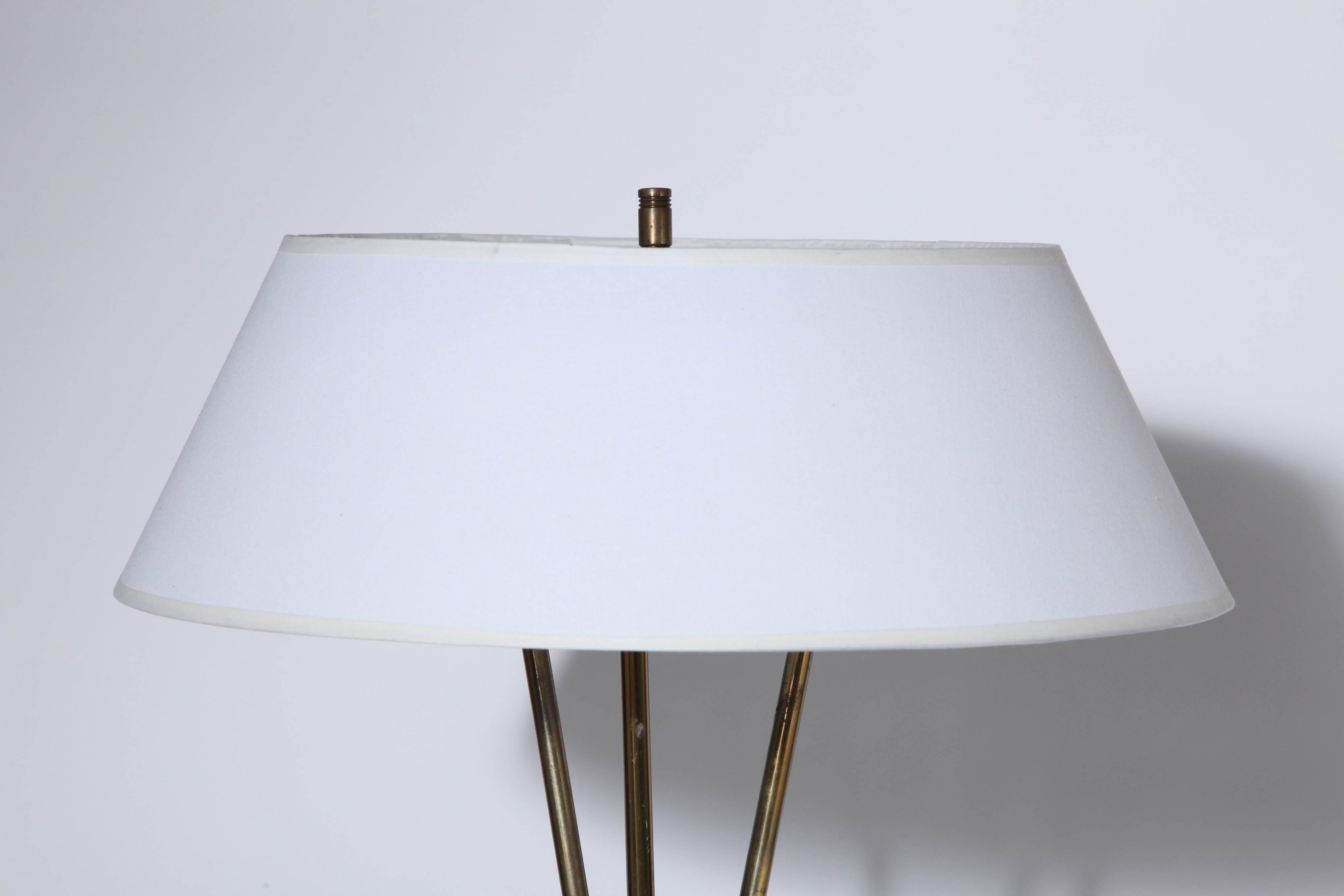 Early Gerald Thurston for Lightolier Brass Tripod Reading Floor Lamp with White Linen Shade. Featuring a joined tripod, three legged patinated Brass framework, Off-White enameled diffuser, new (7H x 20D) White linen shade. Detailed with Brass ball