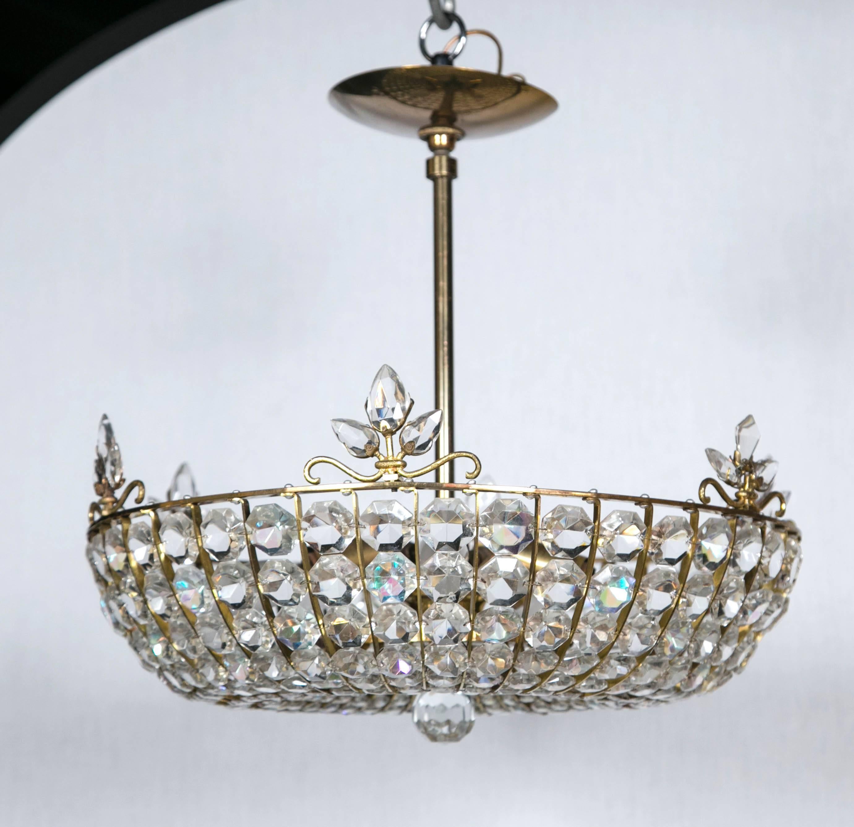 Circa 1930's French beaded crystal light fixture with interior lights inset.