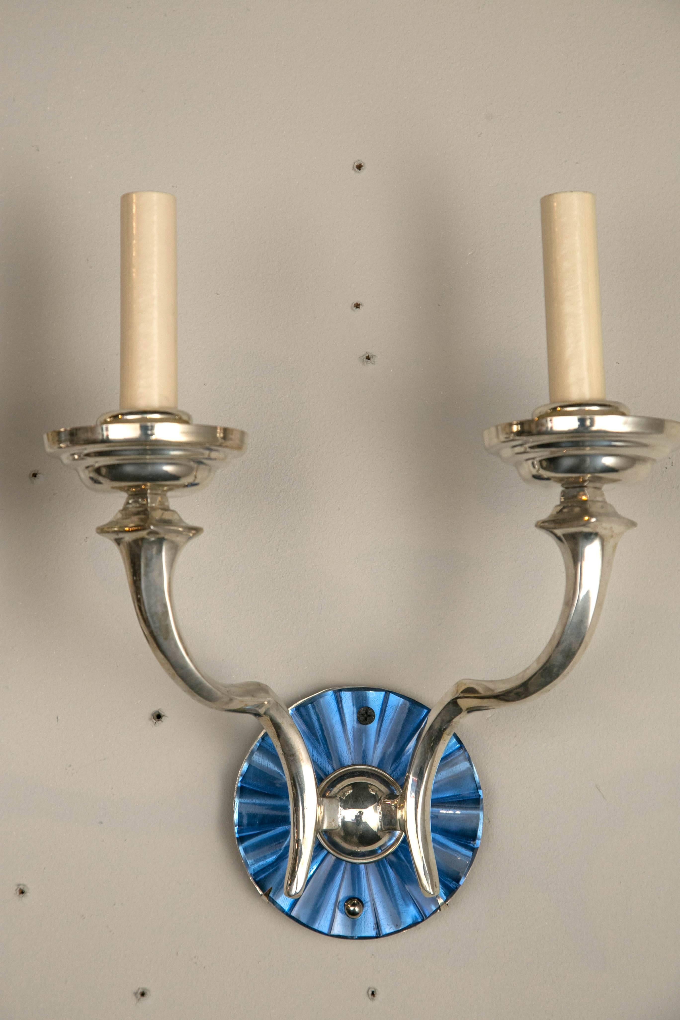 A beautiful pair of Caldwell silver plated sconces with cut cobalt glass back plate
sold in pairs eight pair available.