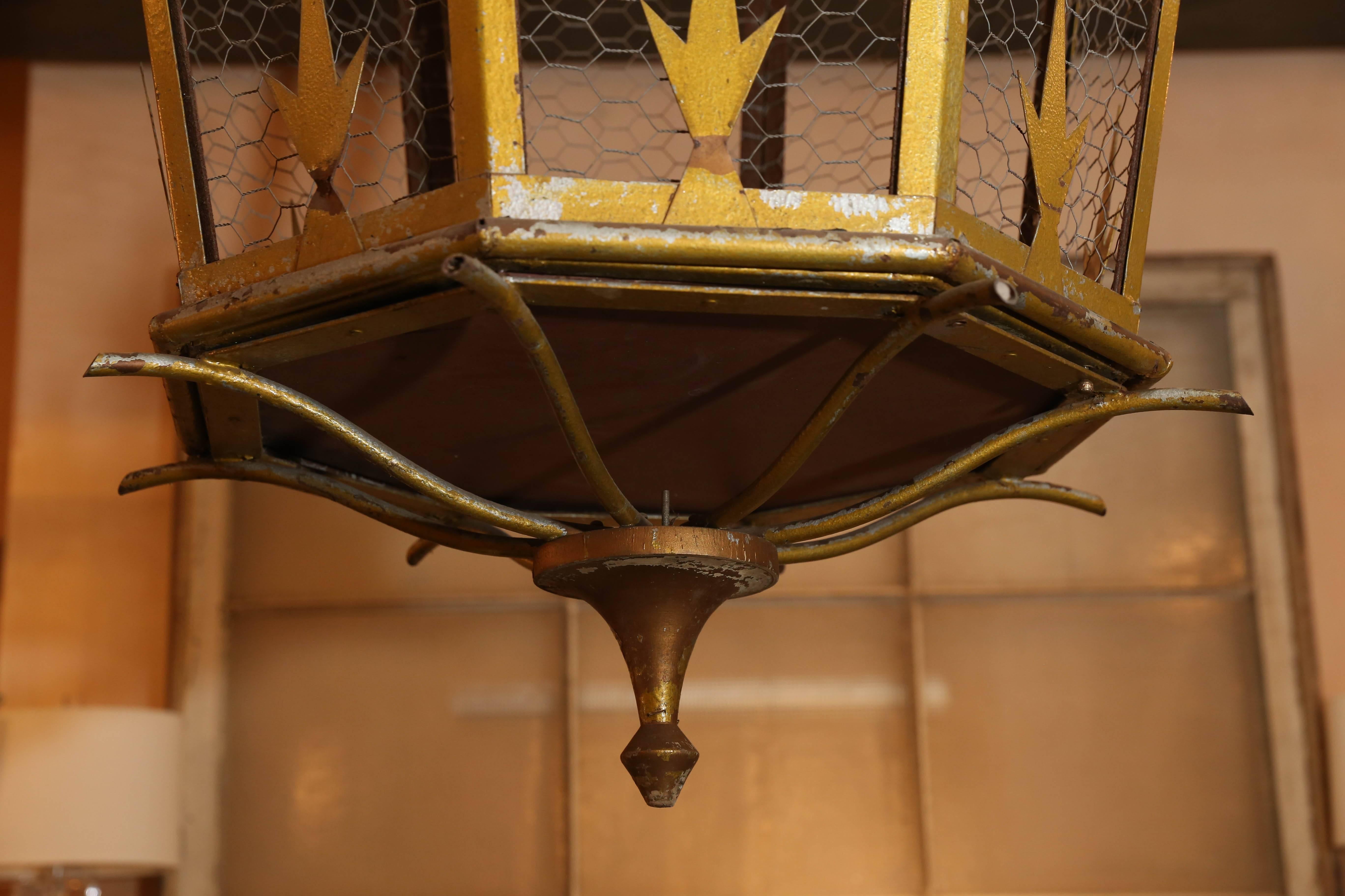 Large octagonal gold-painted lantern from Italy with chicken wire panels. This lantern can be electrified, or fitted as a gas lantern, for an additional fee.