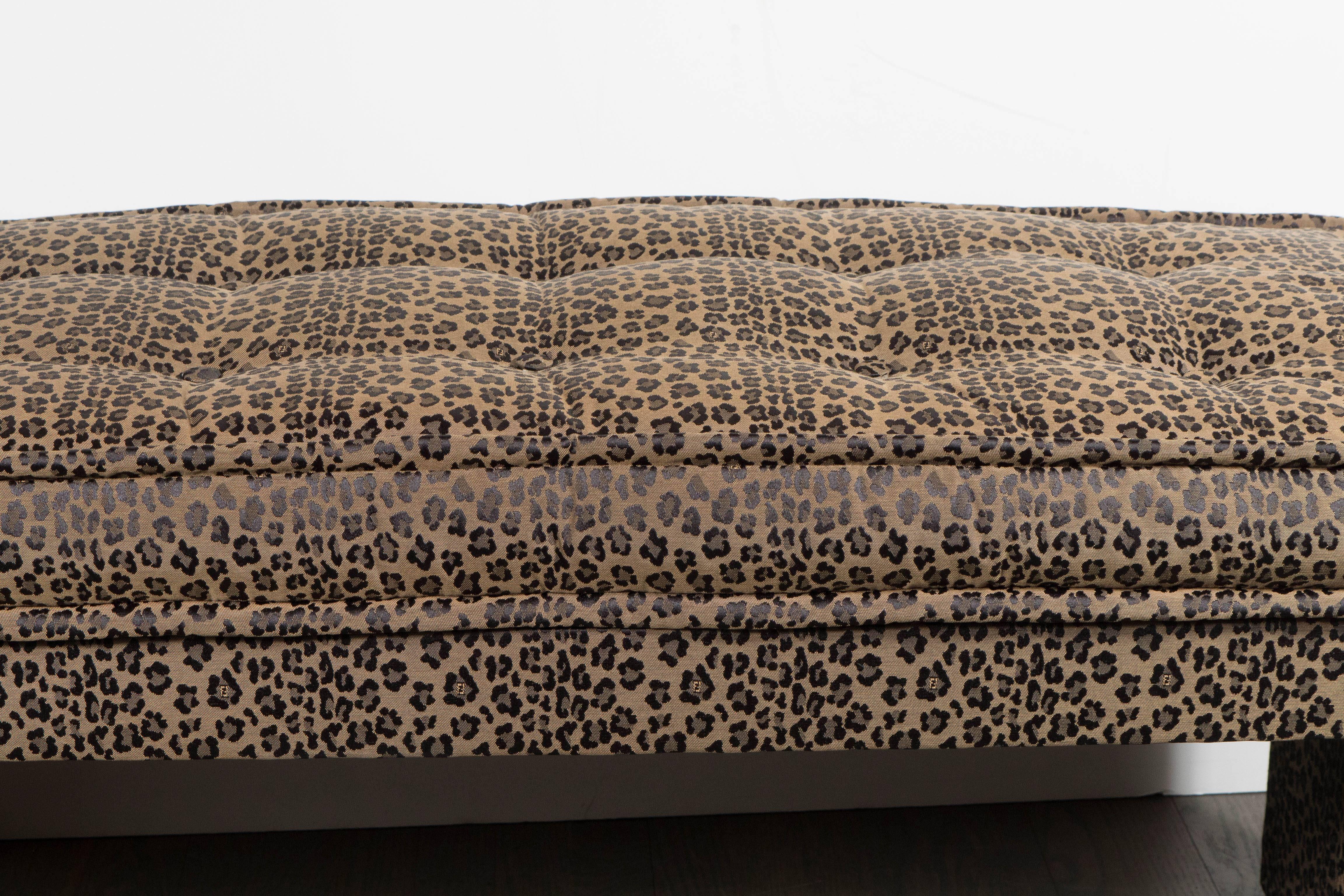 This stunning button-tufted bench produced by the fabled Italian design house Fendi. The piece's fun and confident upholstery recalls the joie de vivre of Italian, 1970s design at its best. It is upholstered in original Fendi leopard-print