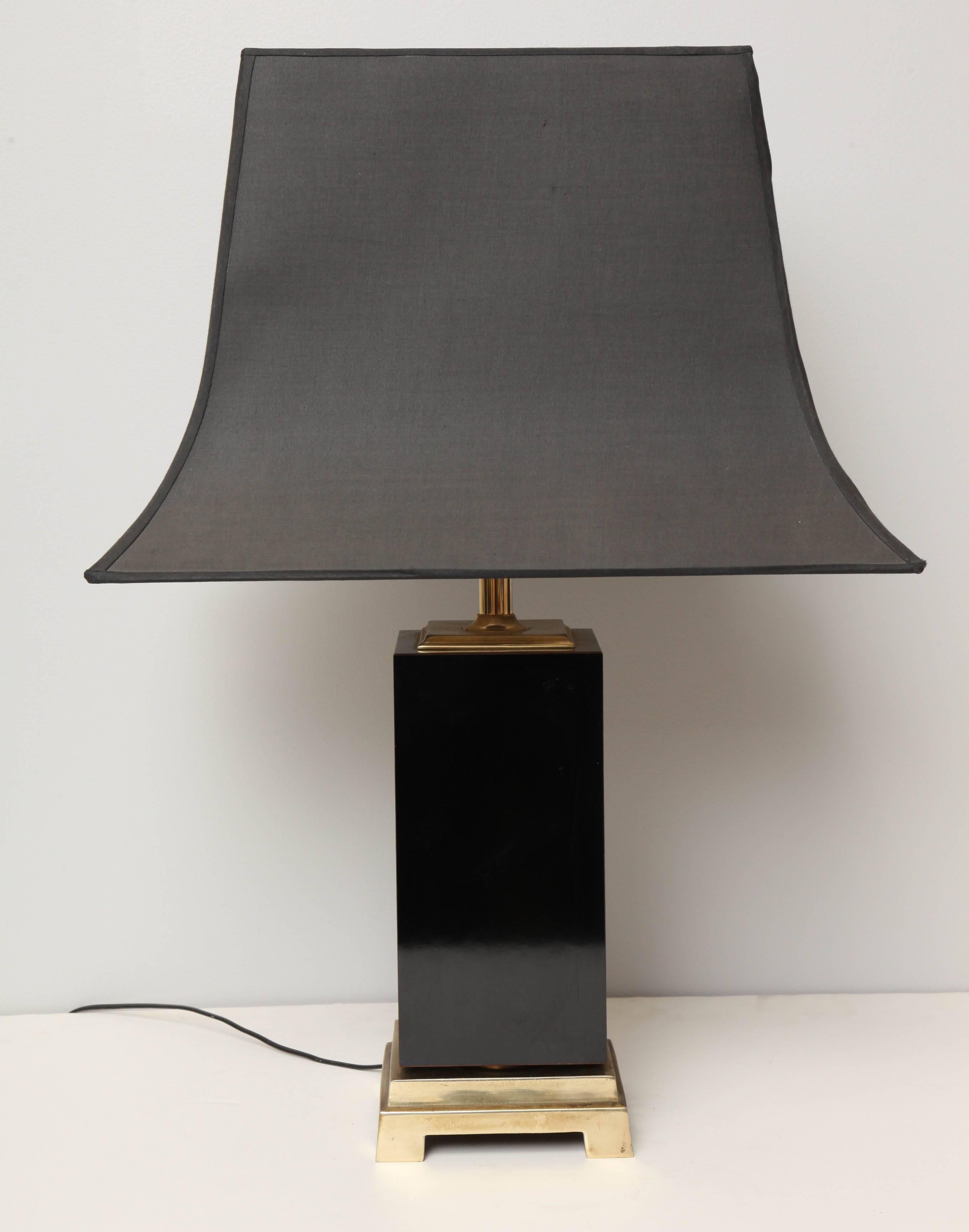 An Art Deco table lamp. Black lacquer, brass and original abat-jour.
Abat-jour measures 22" x 16". Lamp base is 7" x 7". Overall height is 31".
In the chinois style with original linen abat-jour.