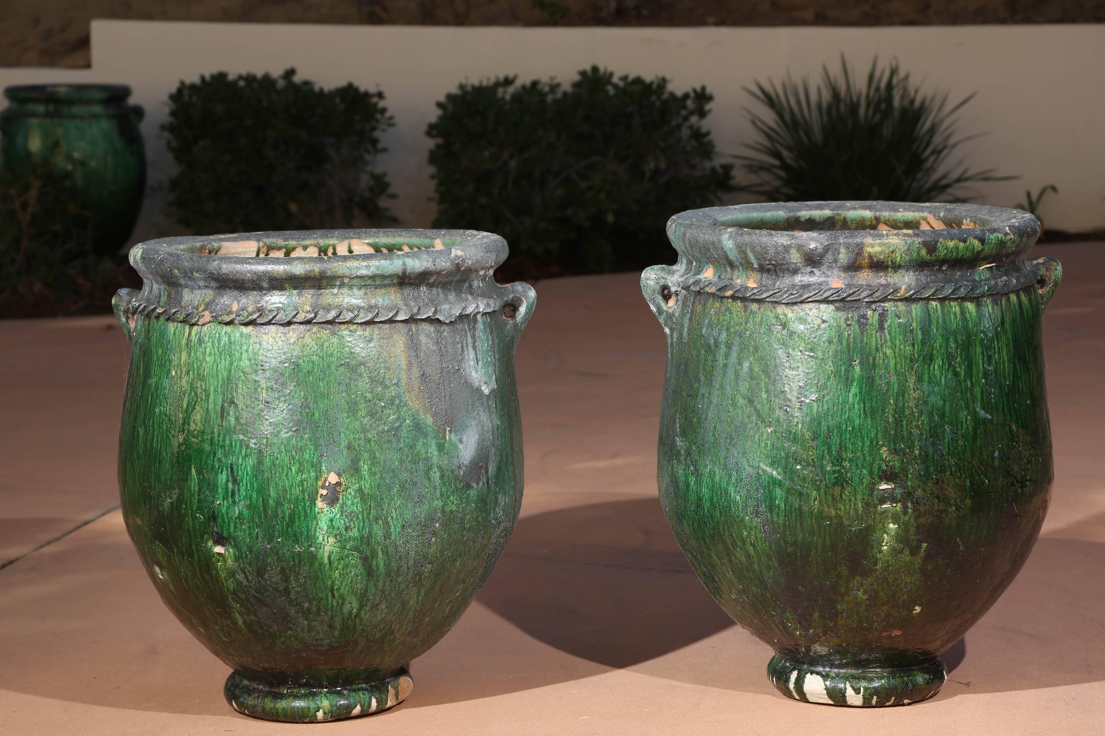 Pair of Large green oversized Moroccan garden planters, olive jars, urns.
Handcrafted in Morocco,  Tamgroute,
Garden ornament planters, great for citrus tree, for indoor or outdoor.
Many more sizes and styles available, each jar is handmade ,