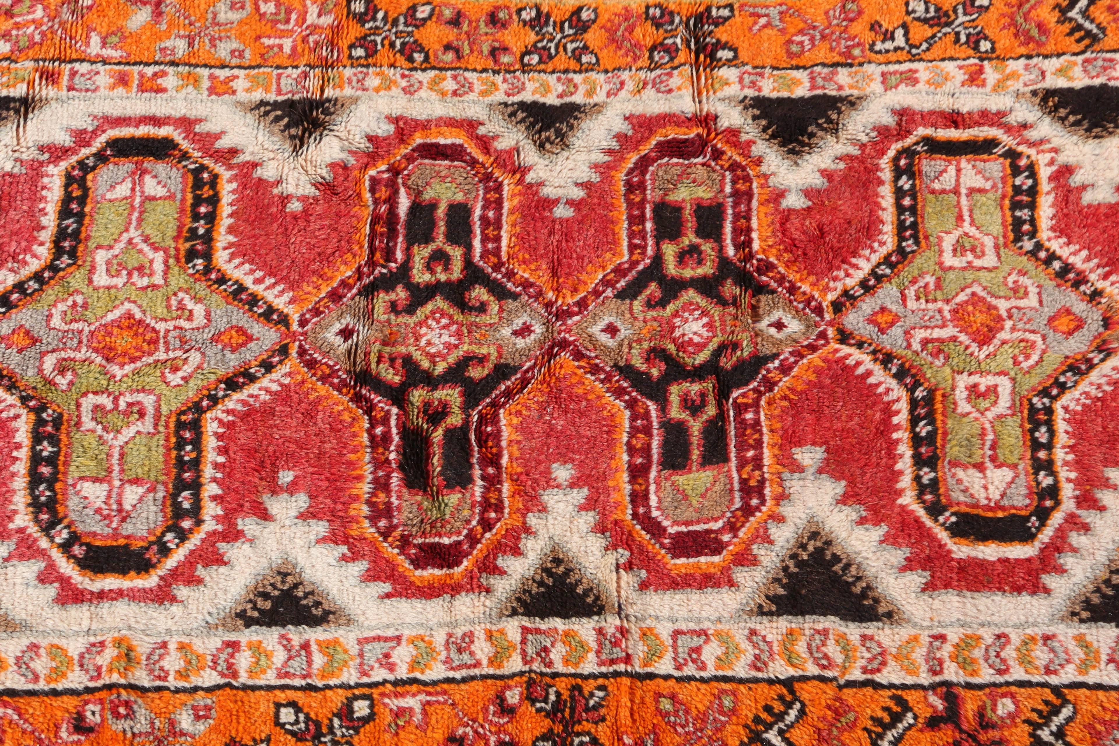 Great Moroccan vintage rug.
Handwoven by the Berber women of Morocco.
Orange colors with pink, ivory red and black geometrical tribal designs.
Great Folk Art African carpet collector textile.