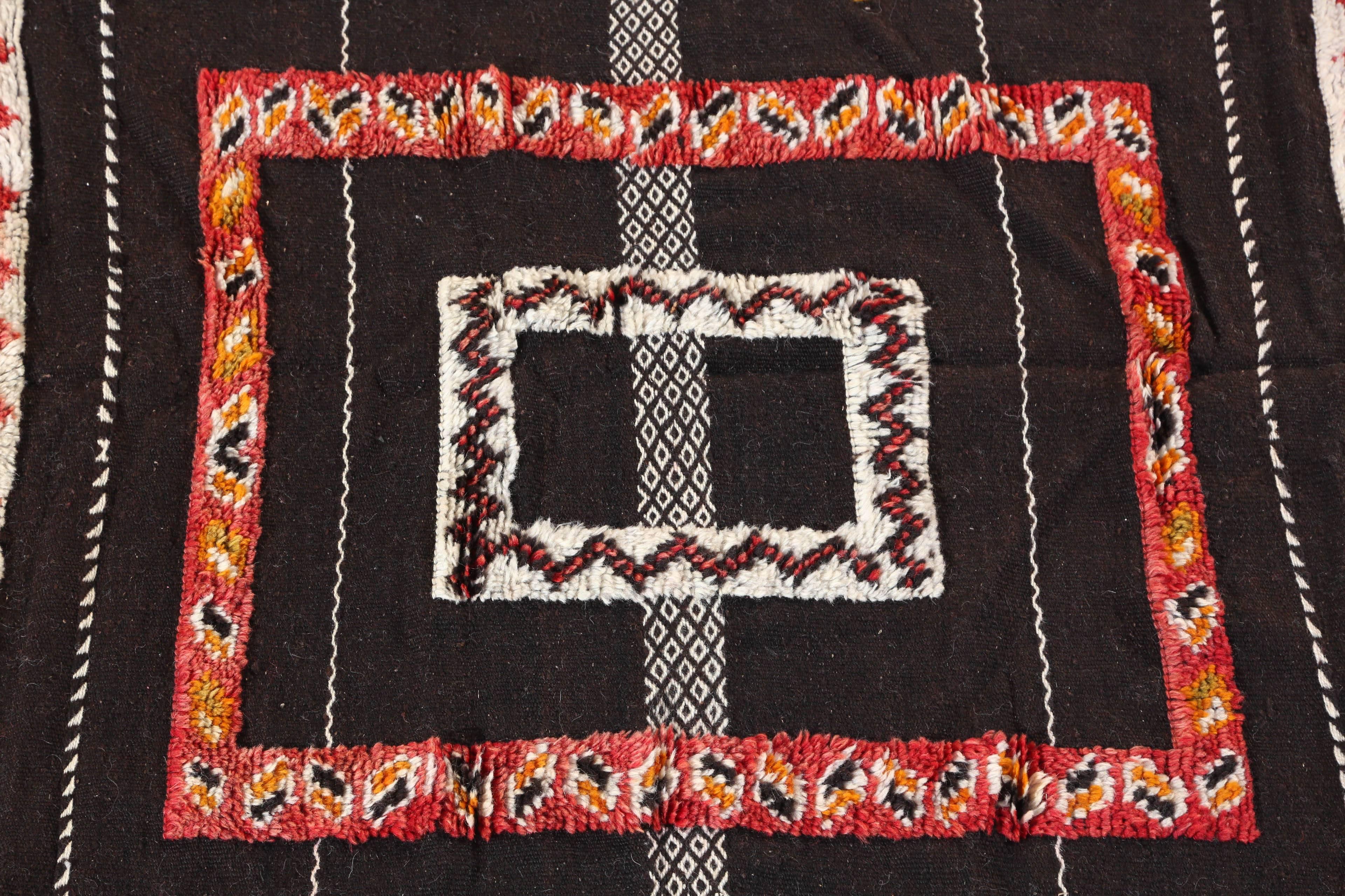 Moroccan vintage tribal African rug with black red and ivory colors.
Square carpet with rows and geometric abstract modern designs. 
Organic dyes wool hand-woven by the Berber women in Morocco.