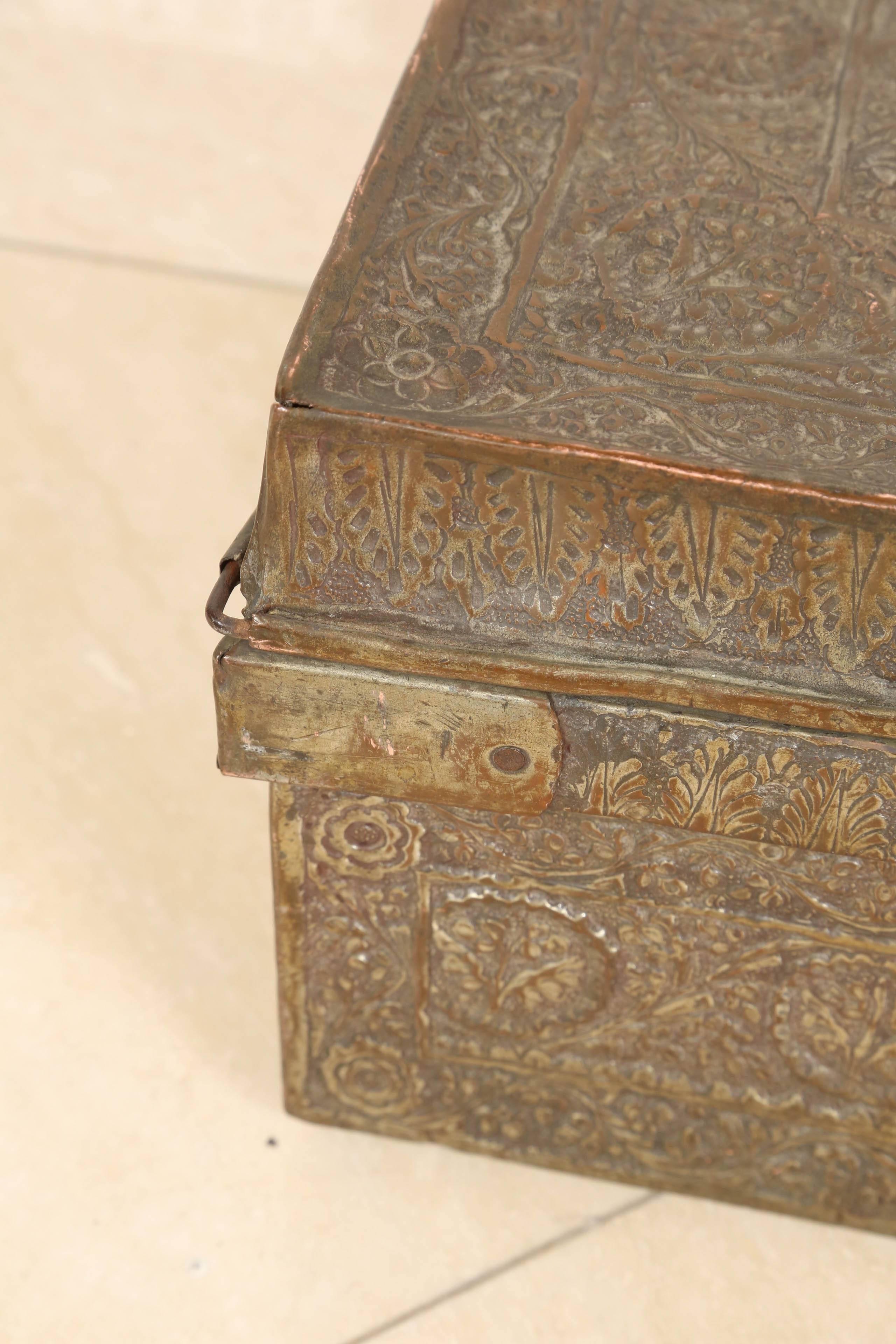 Antique 19th Century impressive Anglo Indian large tinned copper treasure chest / casket, massive size, of rectangular form with hinged lid, hinged handles, profusely embossed with scrolling foliage.
Handcrafted exceptionally large and impressive