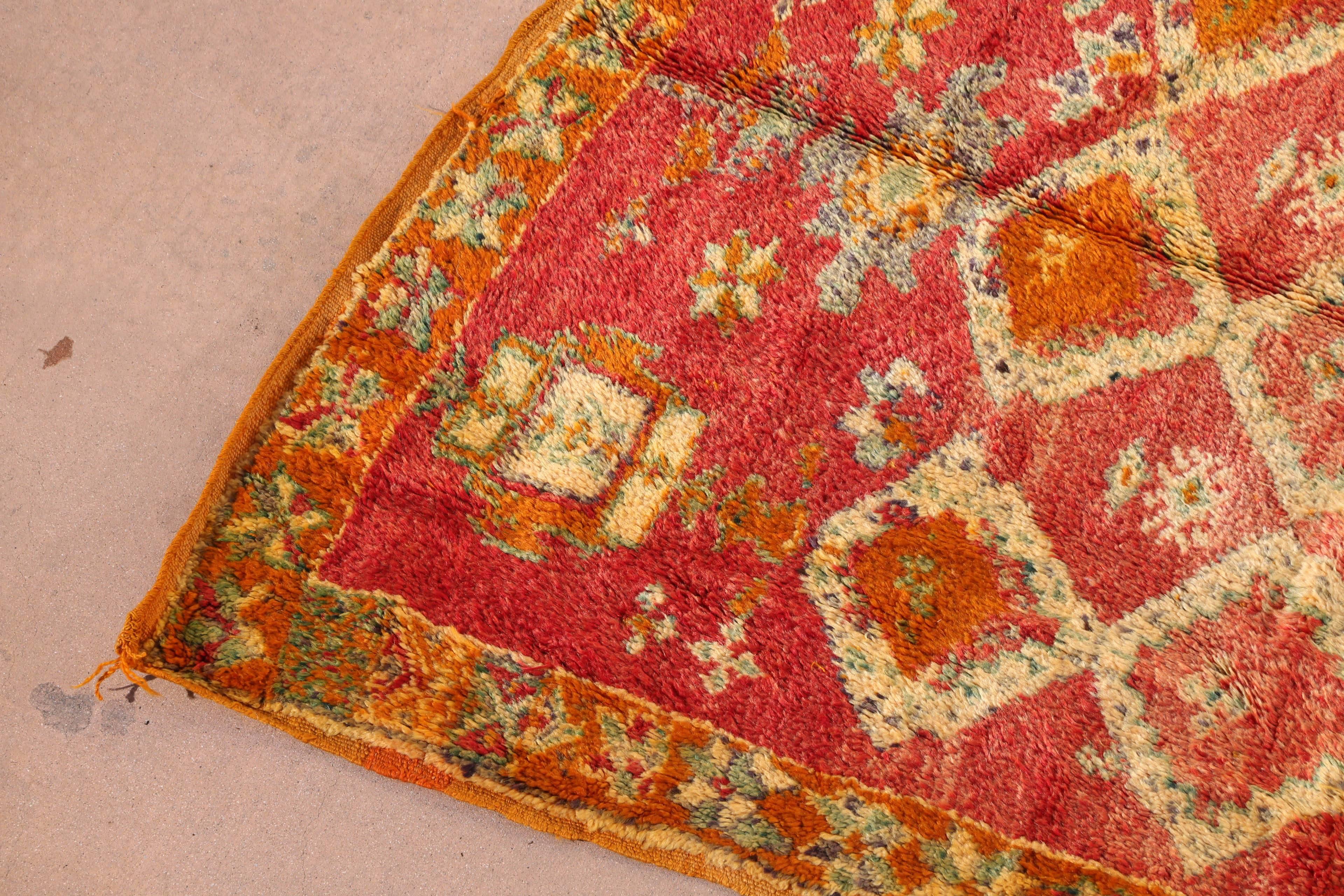 Great happy colors in this vintage Moroccan tribal rug, hand woven by women in Morocco.
Orange with pink, yellow, cream and turquoise colors in lozenges and geometric designs.