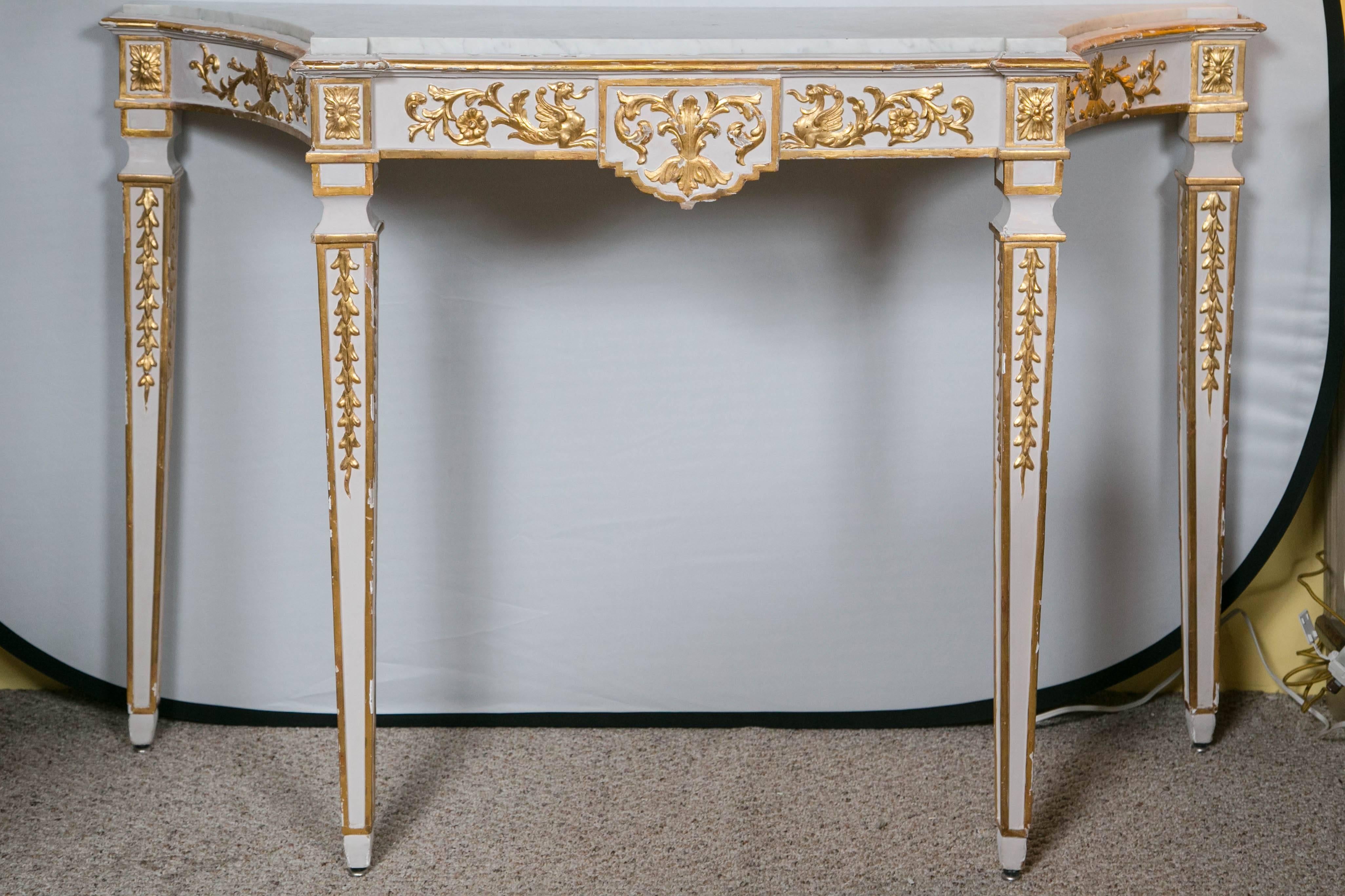 A pair of Italian neoclassical style parcel-gilt and white painted console tables with White marble tops Sotheby's NY October 11.2012 sale number: 8879: Lot 105. Provenance Sotheby's, NY October 7, 2011 - Lot 483. 

Absolutely spectacular pair - a