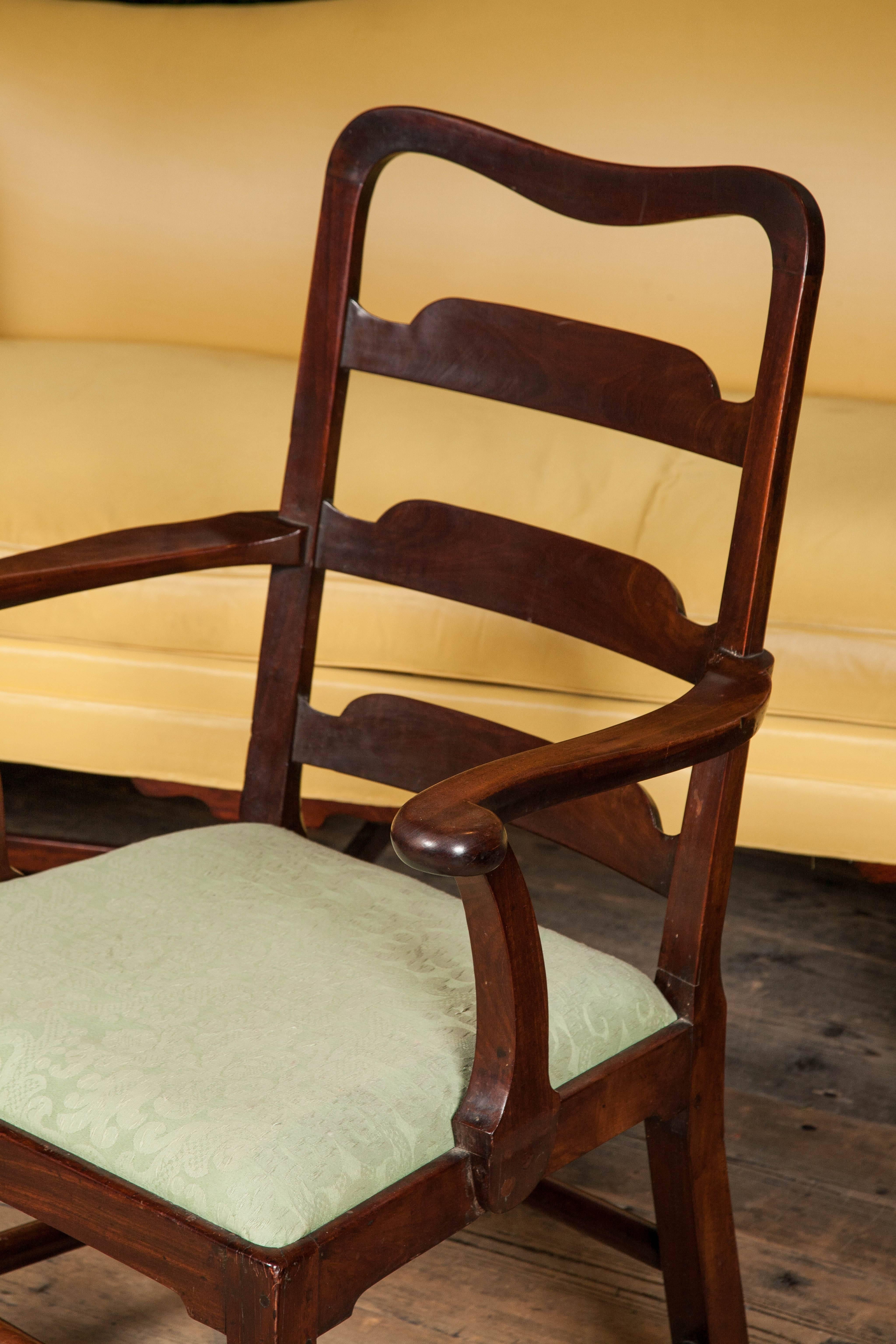 Set of eight George II mahogany dining chairs. Including two elbow chairs, English/Irish, circa 1750.
 