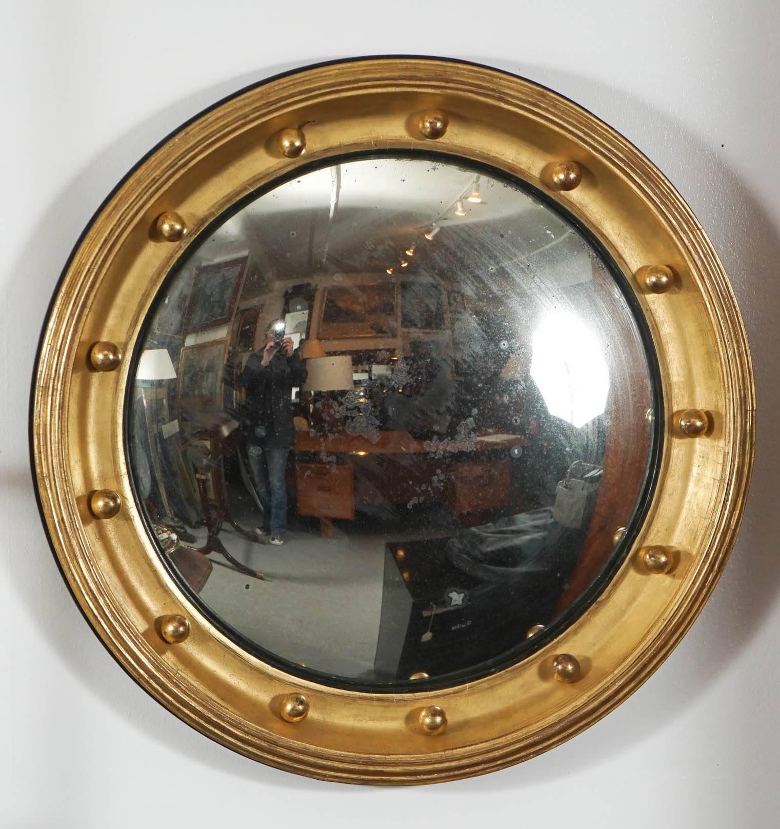 English regency convex mirror with original gilt and glass. 