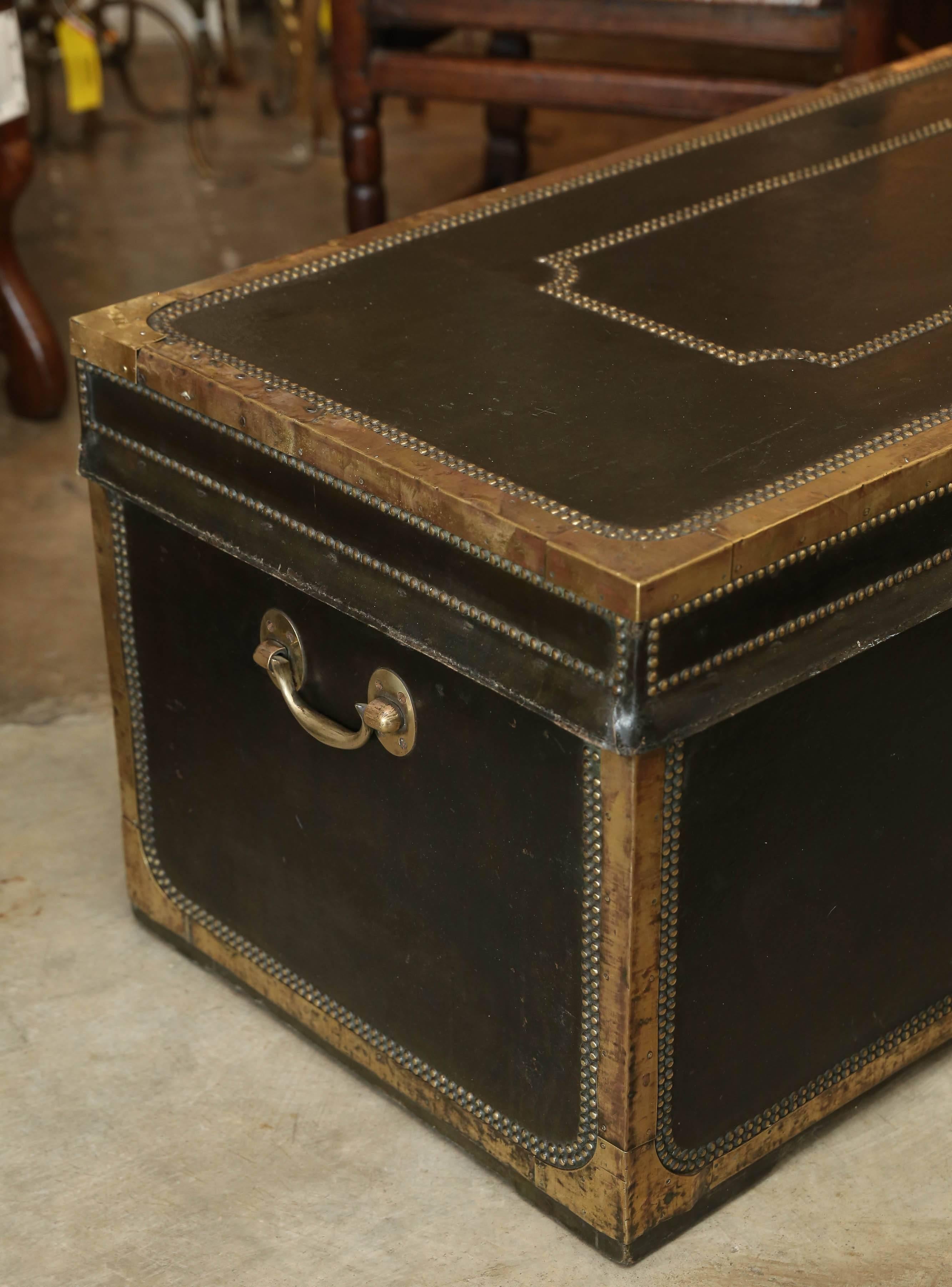 British Military Campaign leather camphor wood trunk covered with a double row of brass nails and brass detail.