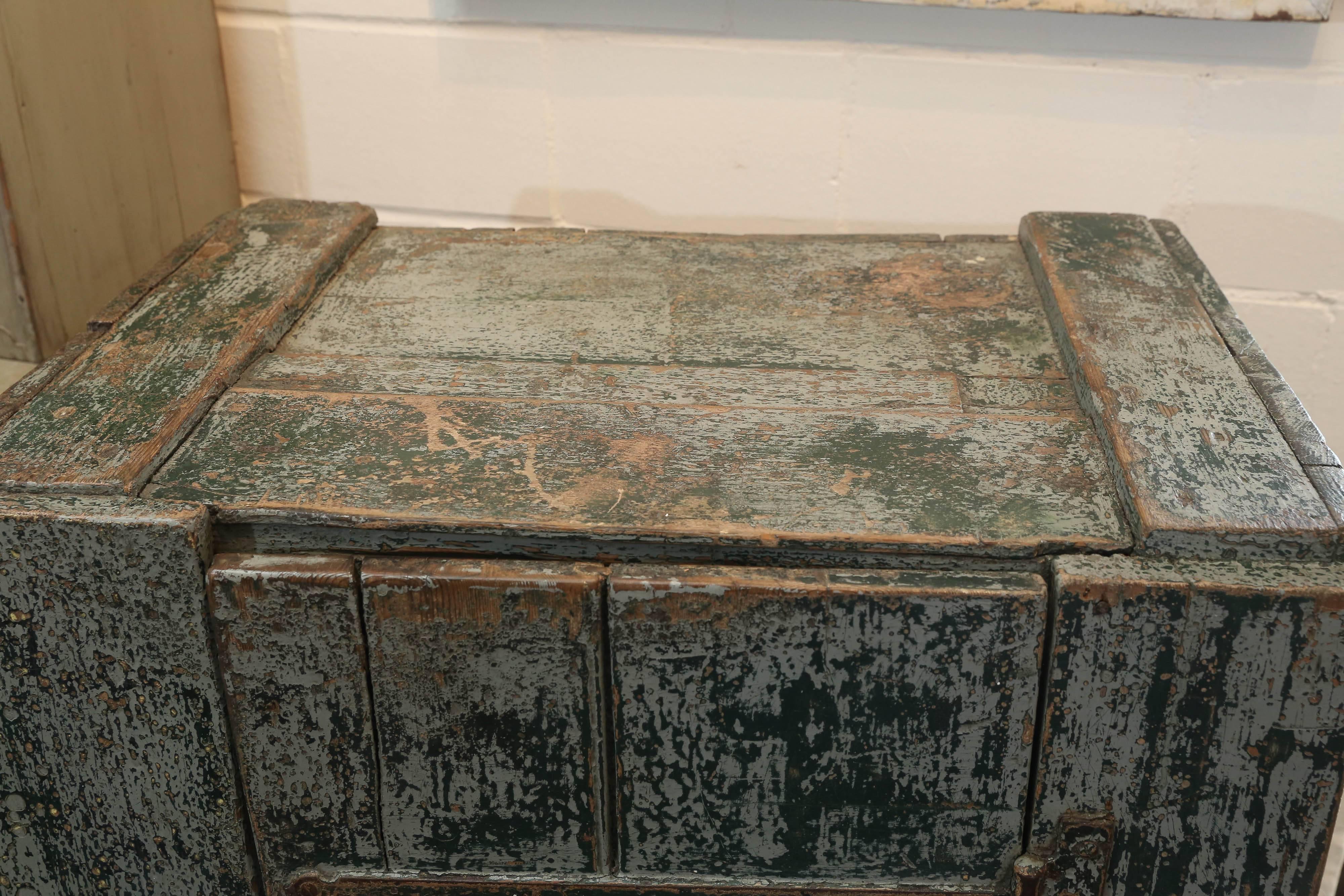 19th century workman's cabinet with original layers and layers of paint and a single door. Original hand wrought iron hardware and brass closure. Wonderful patina!