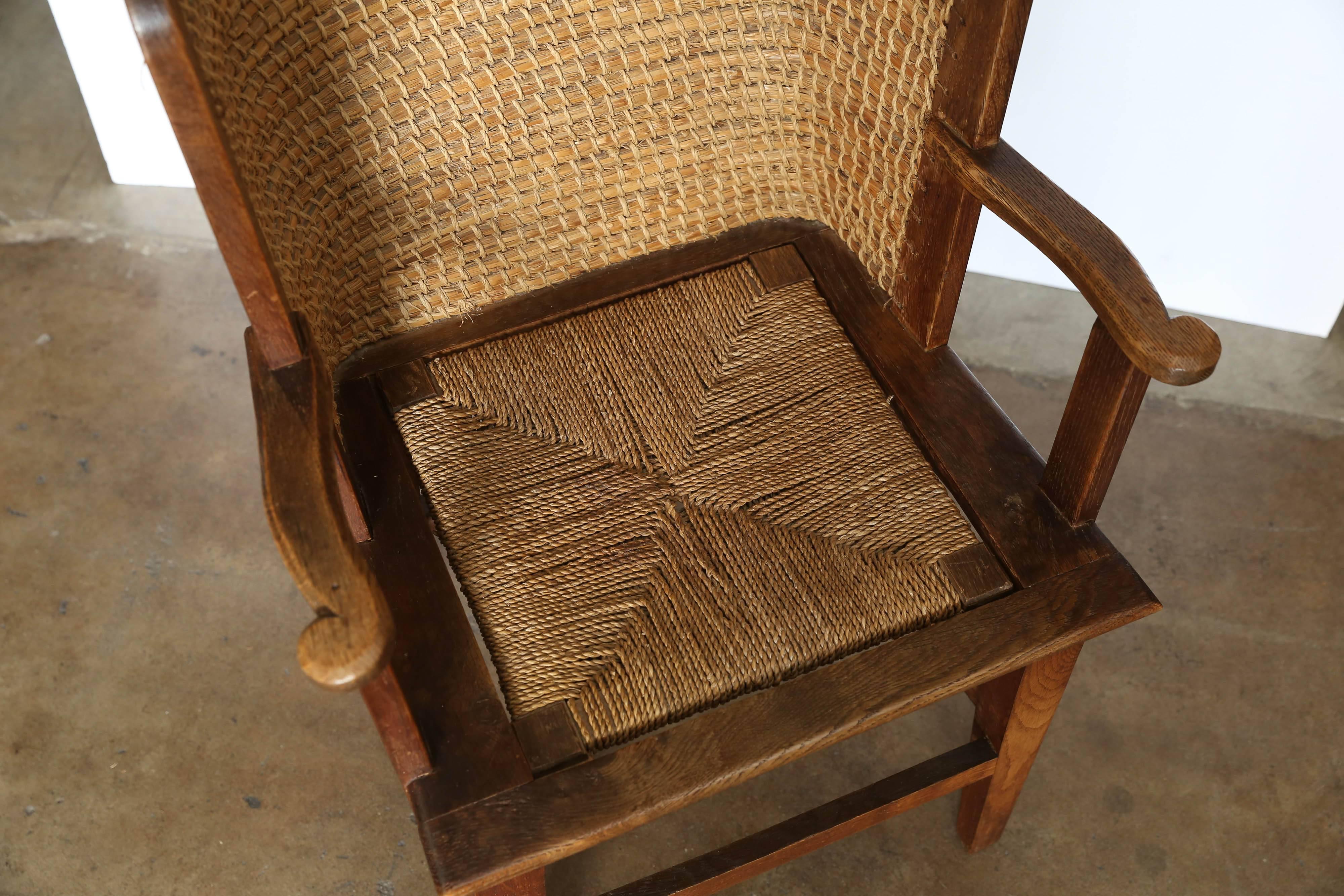 Child's orkney chair with woven reed back and wooden frame. Seat is removable, circa 1900.