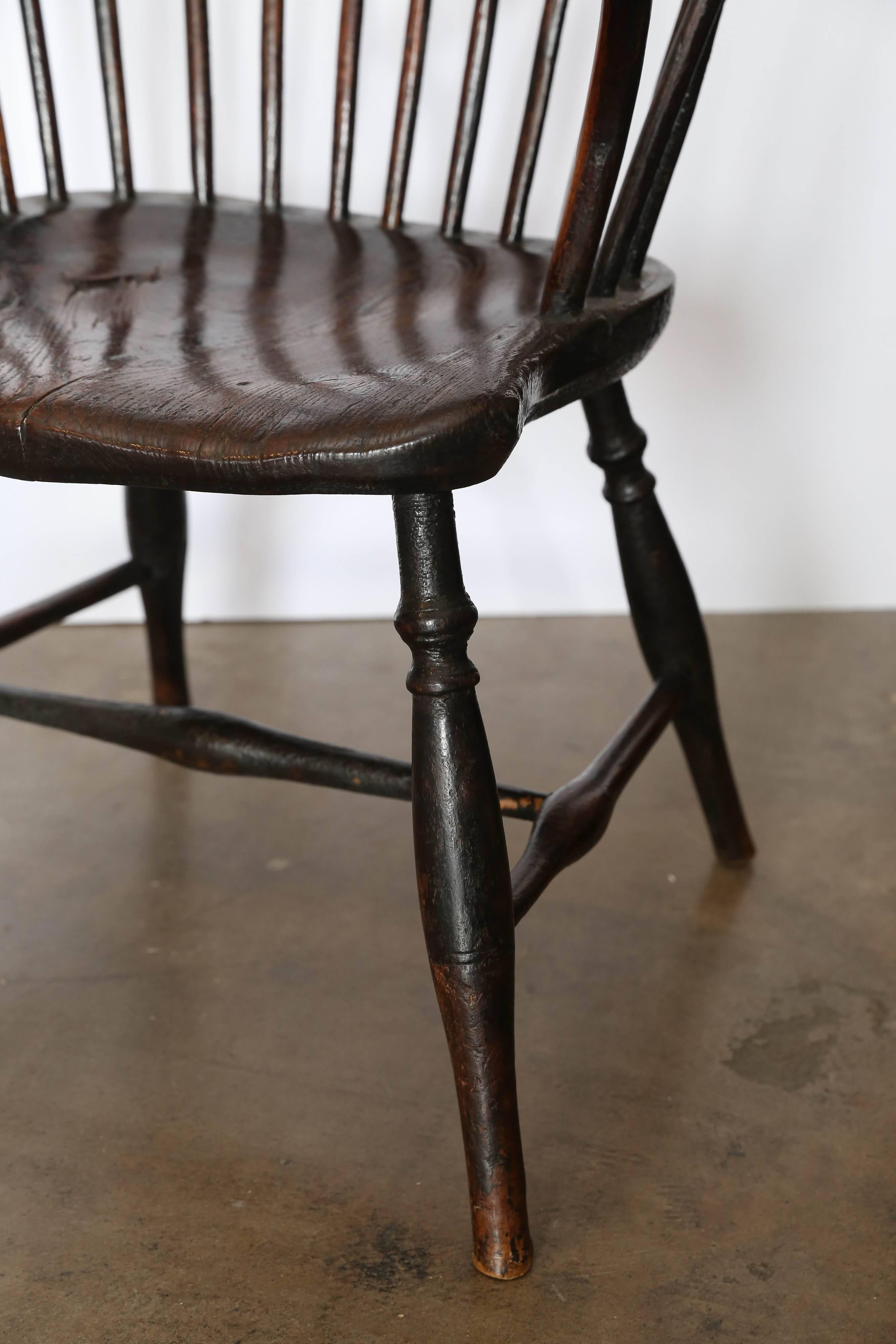 19th century windsor chair, circa 1840. Beautifully worn seat and arms.