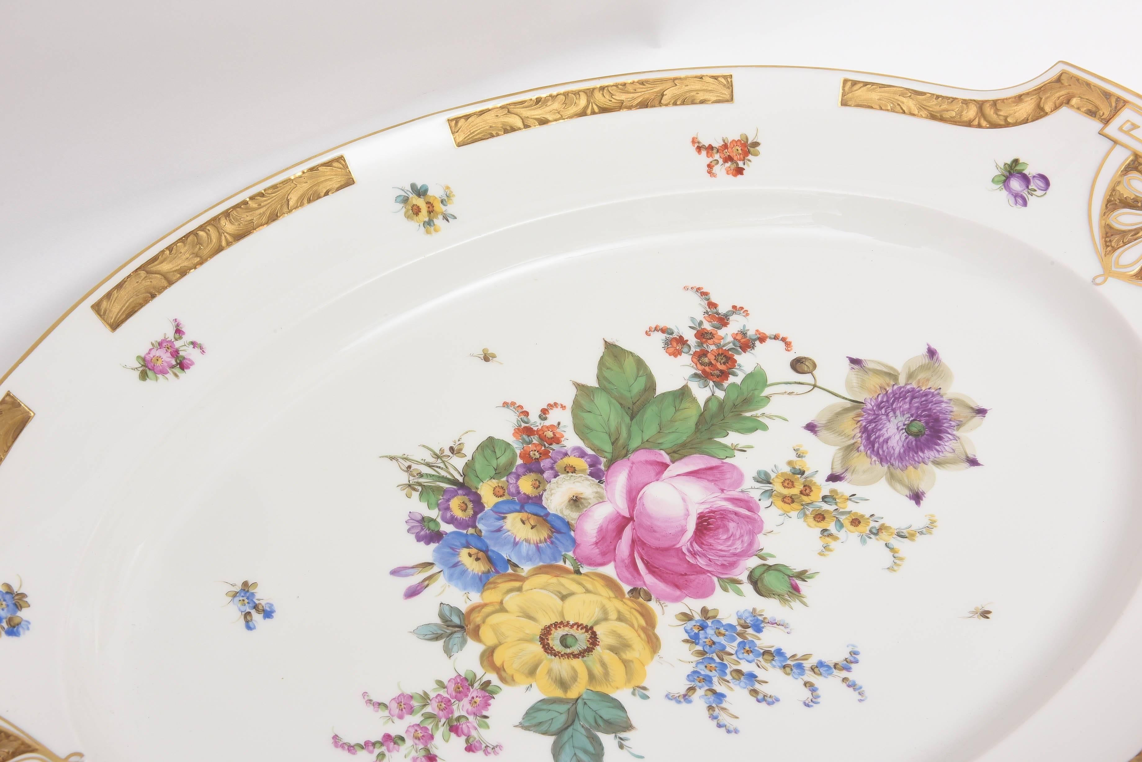 An impressive (and heavy!) pair of last quarter 19th century KPM, The Royal Factory of Berlin, Platters. Finely detailed and molded shape with shell edge with raised floral border surround. Completely hand painted and lavishly gilded these platters