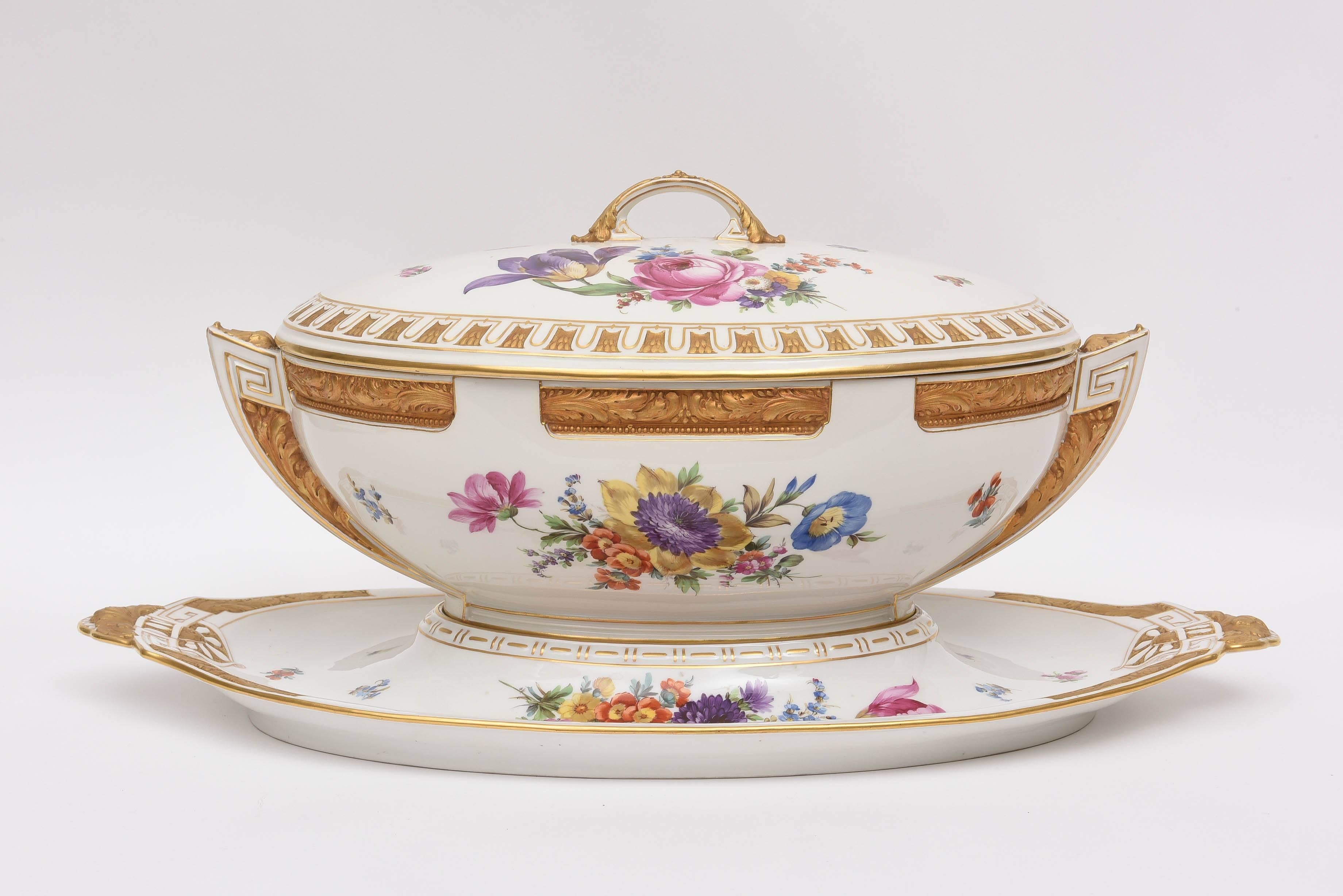 An oversized and grand 3 piece tureen, cover and fitted stand by KPM The Royal Factory of Berlin. Completely hand painted with heavy hand painted enamel florals and gold. A very detailed porcelain 