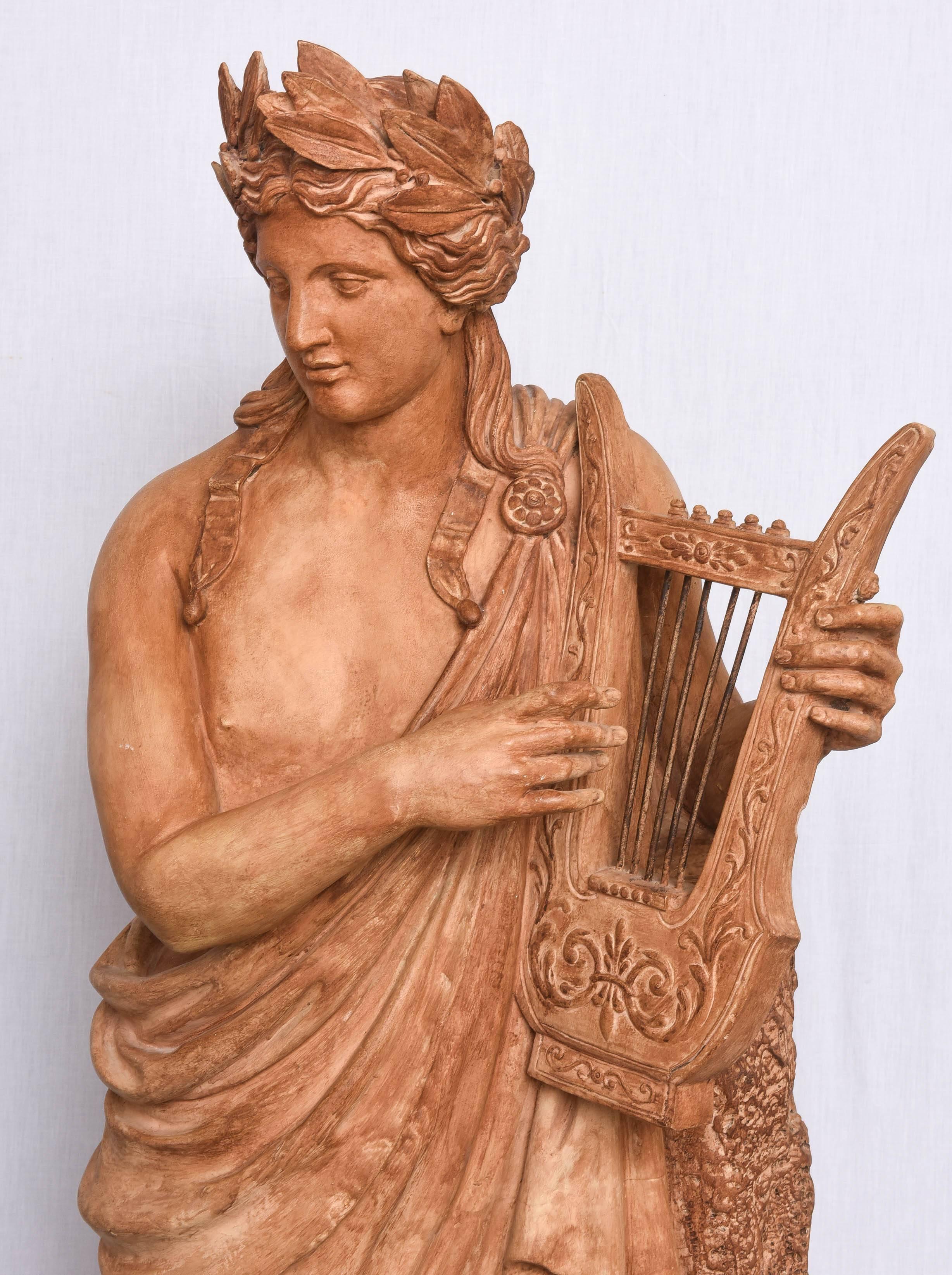 This amazing 19th century Italian terra cotta garden statue of the Greek god Apollo playing a lyre will make the perfect addition to your garden or perhaps your garden room. The piece is perhaps a Roman copy of a Greek sculpture with his crown of