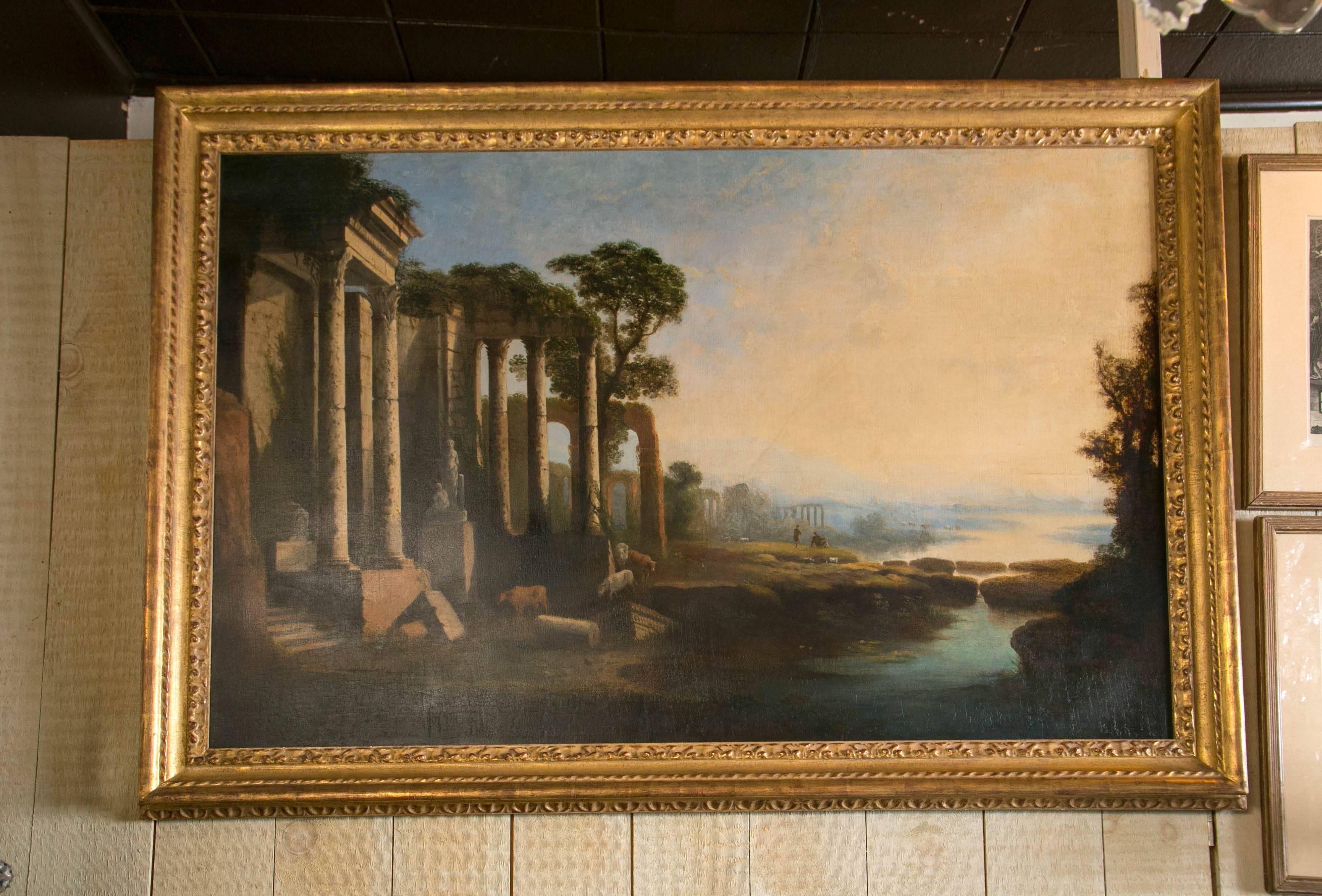 A large painting of ruins within a water landscape. Within a giltwood frame. Repair in center of sky.