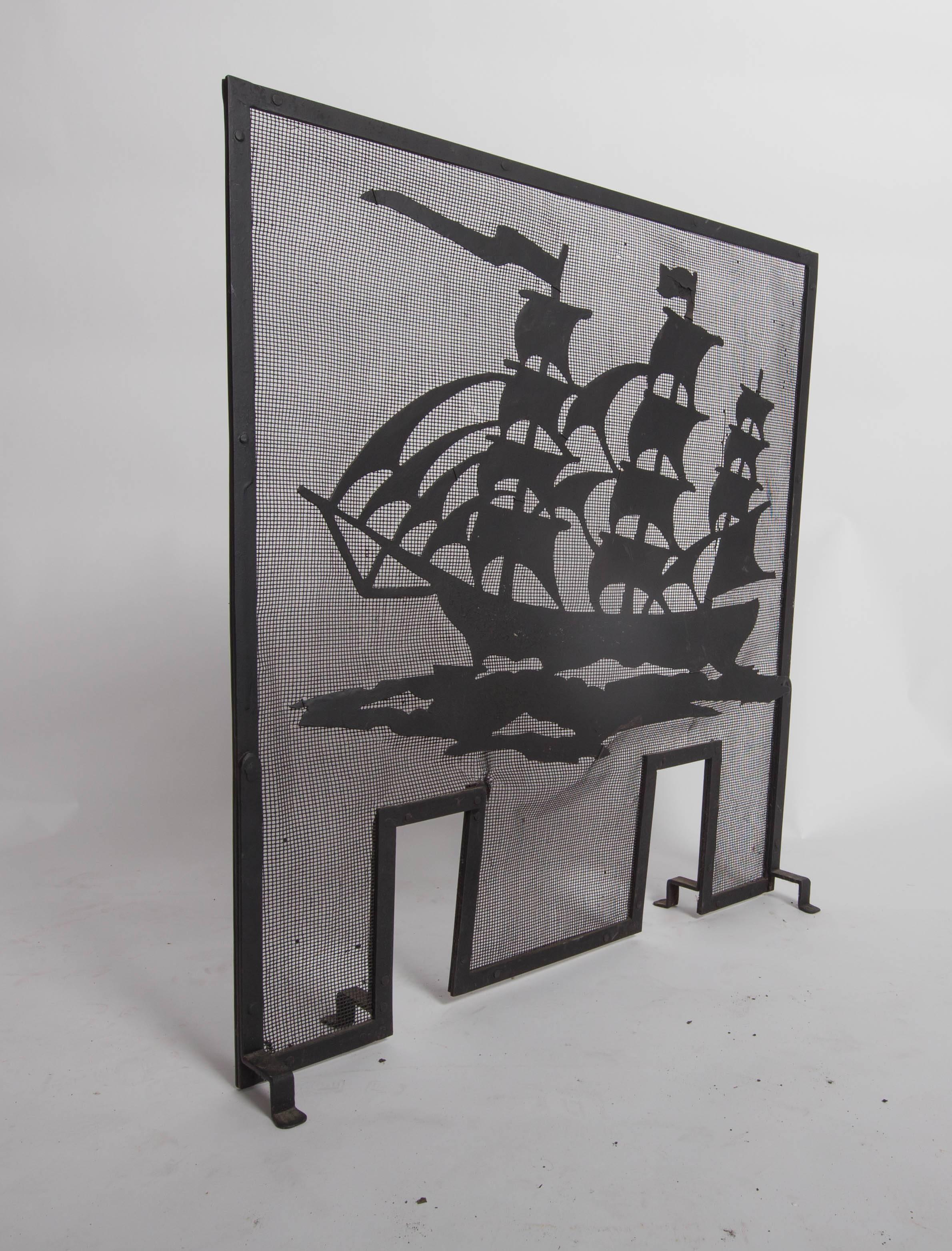 Strap iron fire screen frame with applied sheet steel Silhouette of a three-mast ship underway, in black paint, circa 1910s.