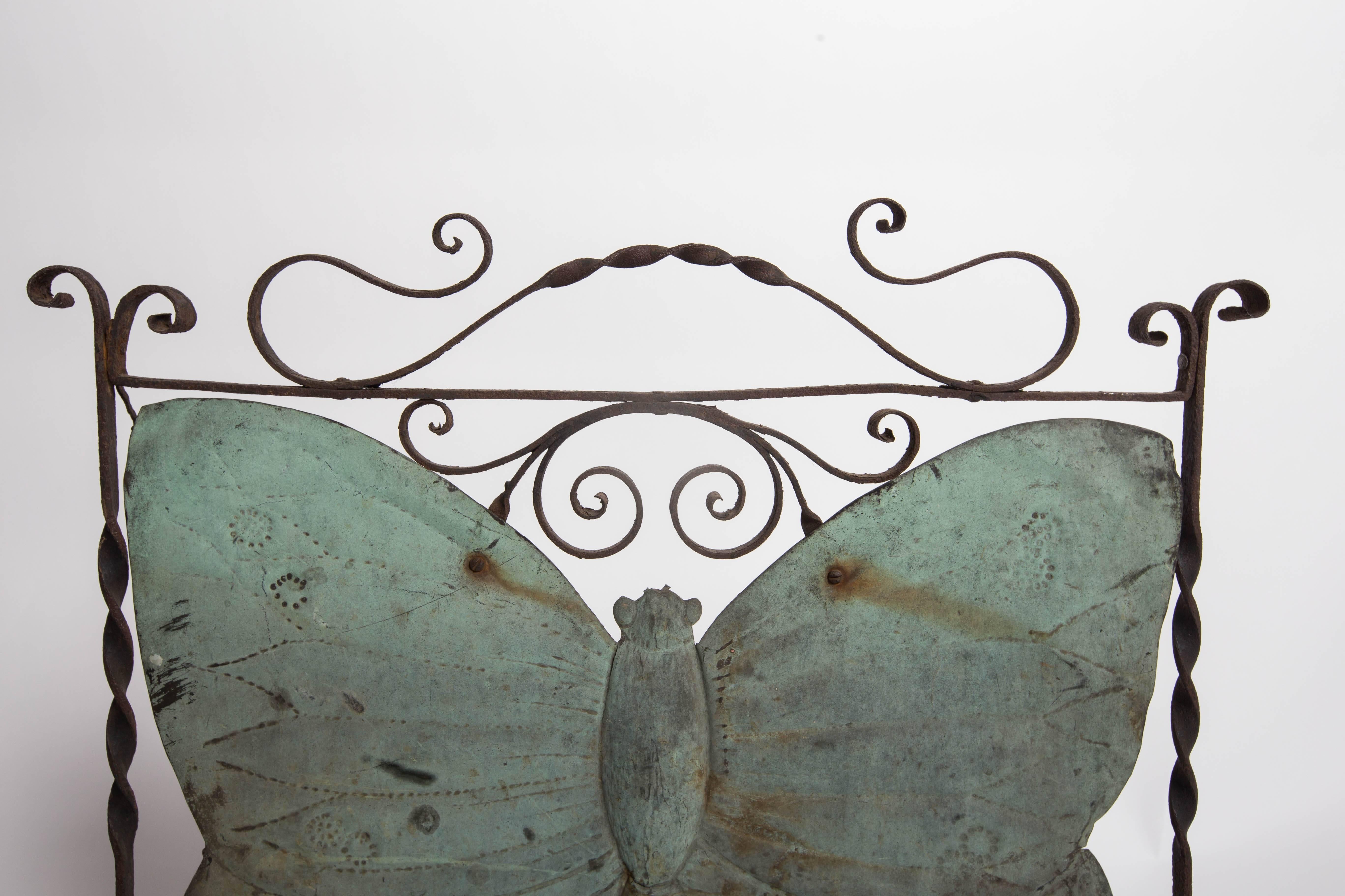 Wrought iron screen frame with applied hand-hammered copper patina butterfly, light corrosion, nice verdigris, circa 1910.