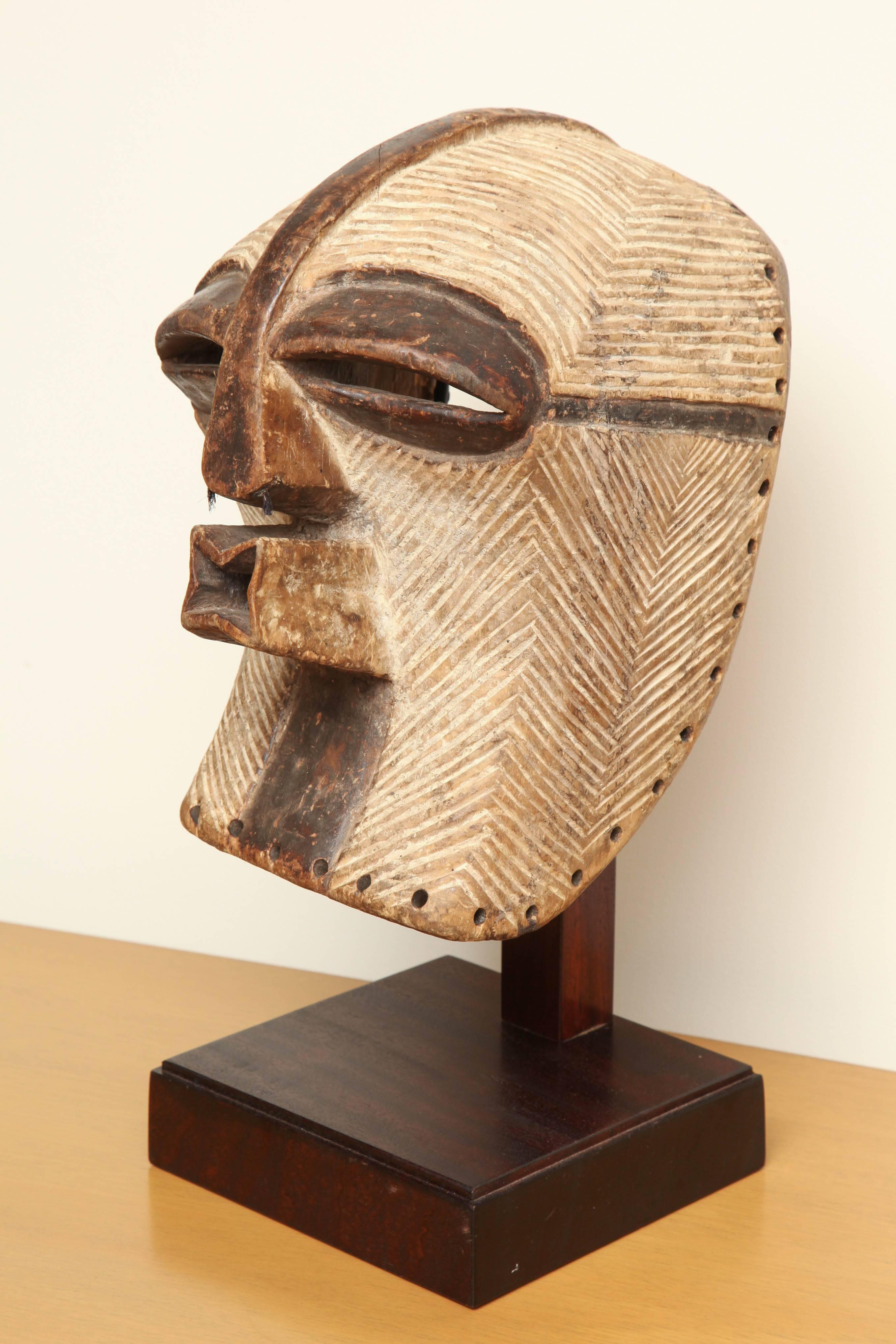 19th century Kifwebe mask from the Songye Tribe in the Democratic Republic of the Congo. Mounted on iron stand.