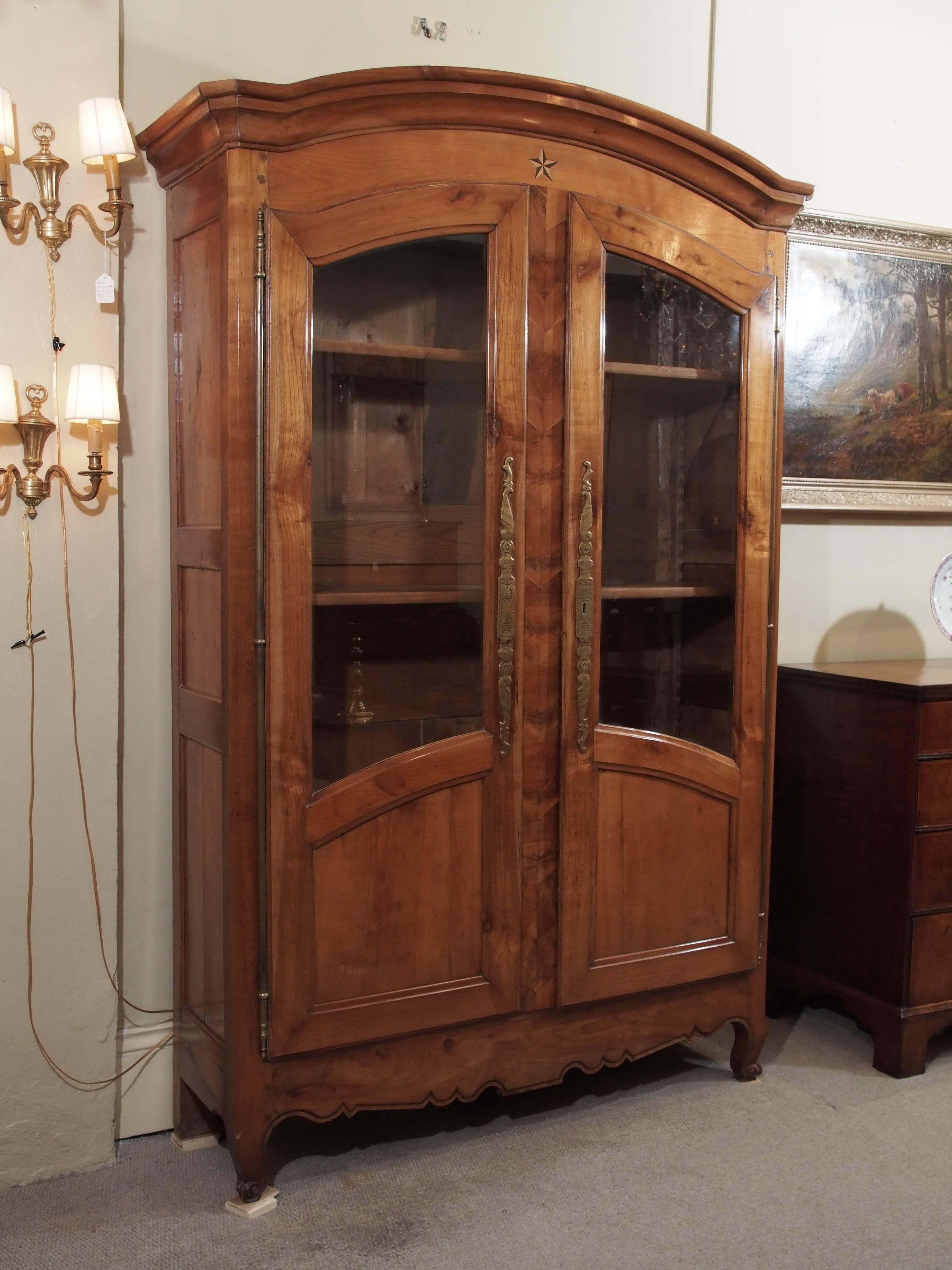 Antique French fruitwood inlaid bookcase/display cabinet.