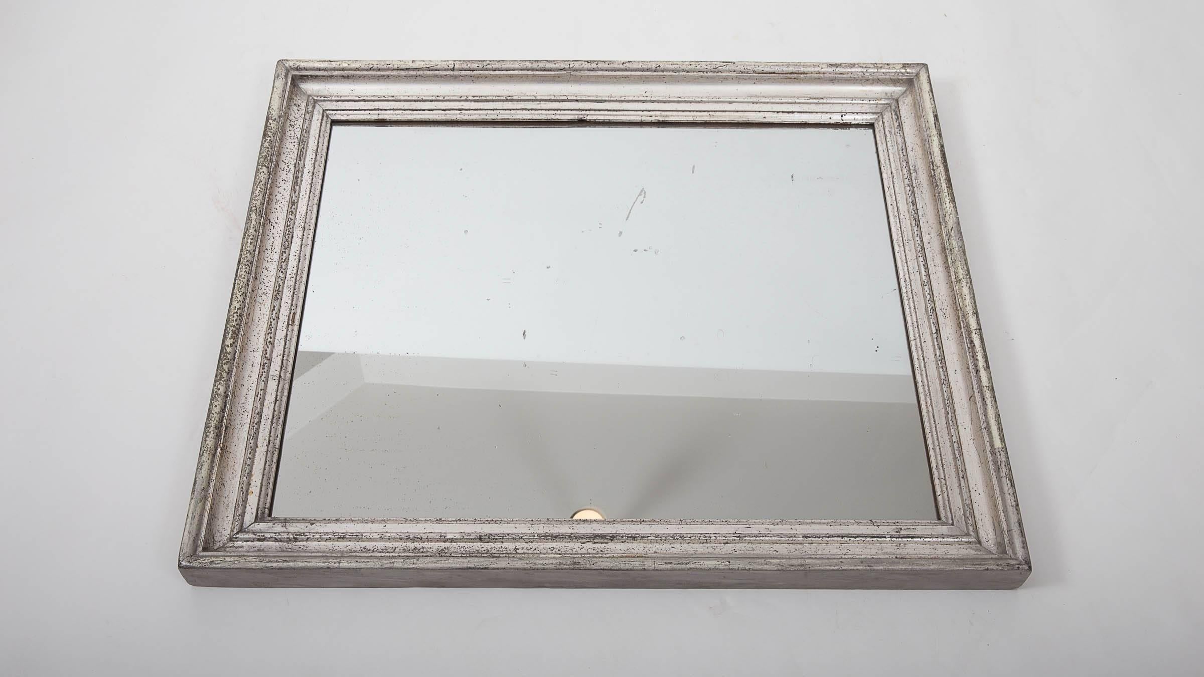 Silver giltwood mirror with original mercury backed mirror.