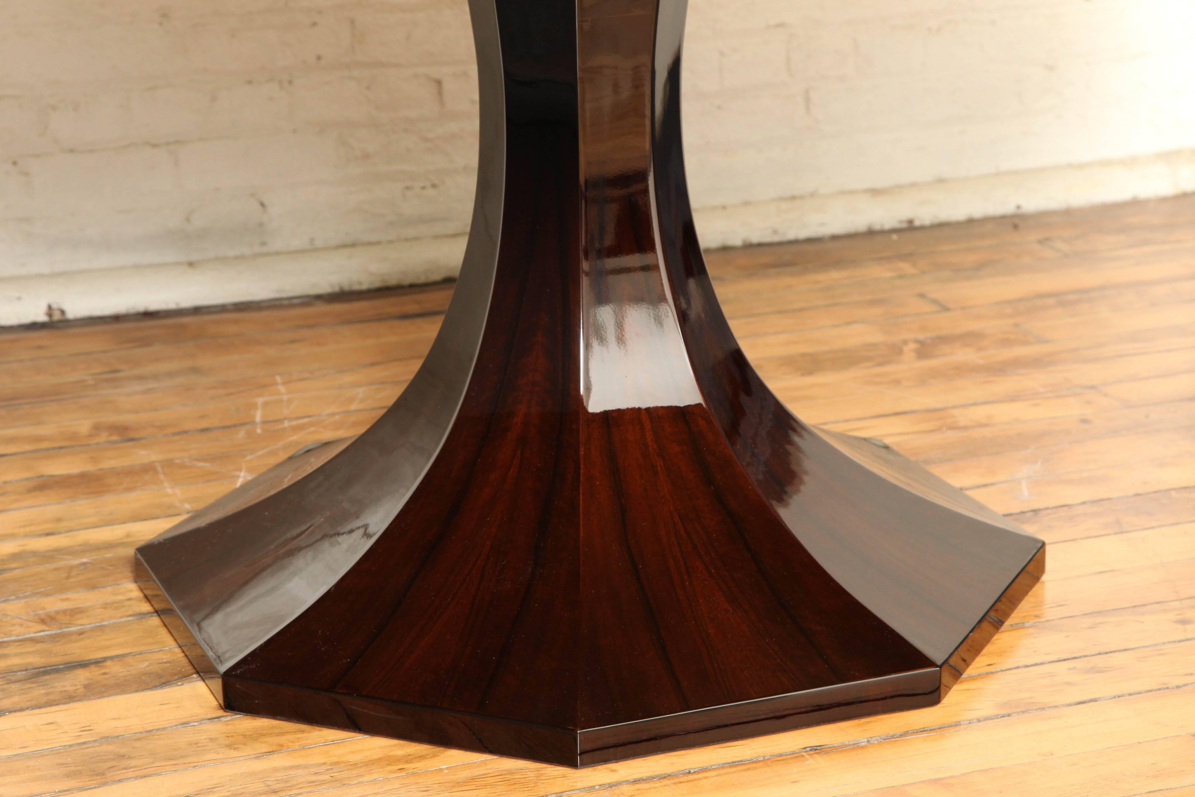 Elegant round Art Deco pedestal dining table. Inlaid black forest walnut.
 