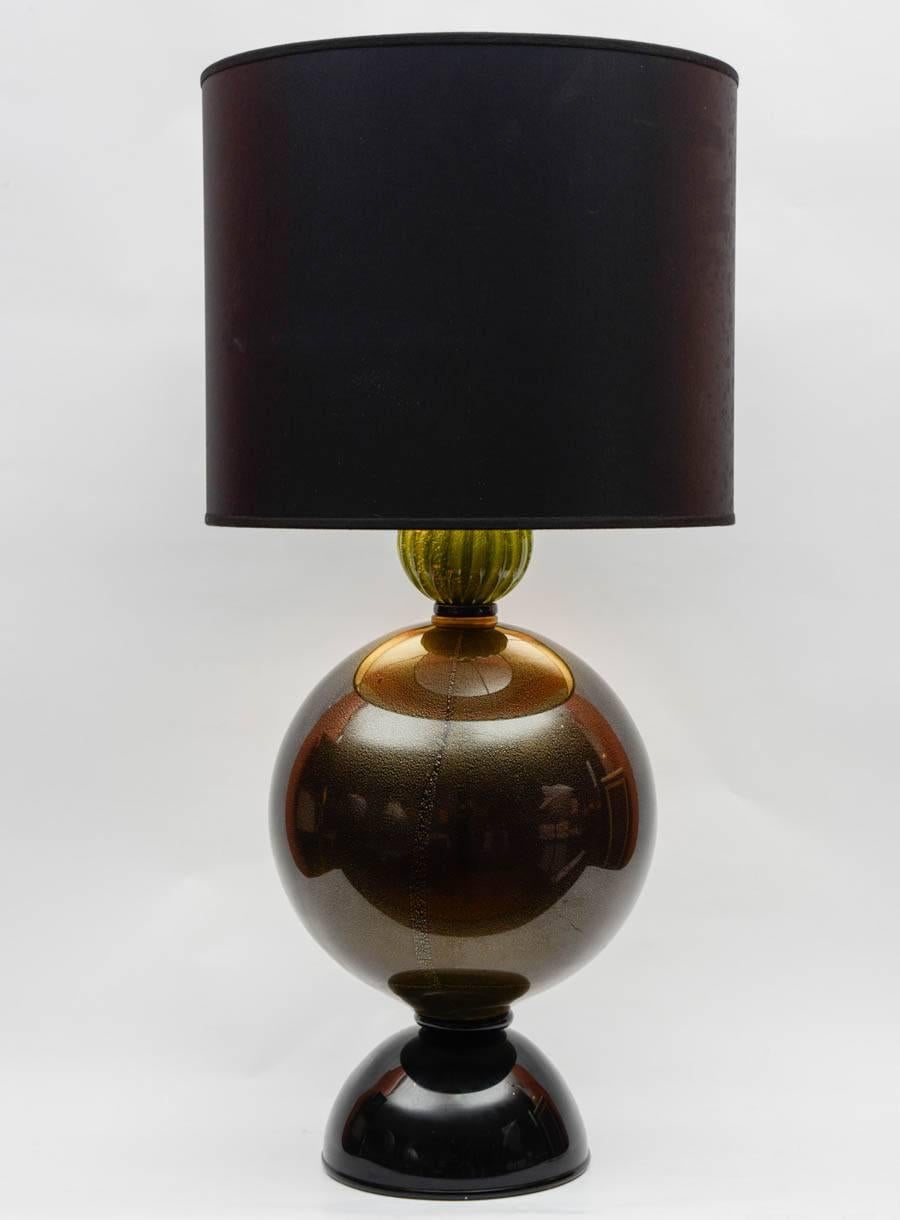 Pair of Murano glass lamps with inclusions of gold sheets.
Dimensions given without shade.
Shade are not provided.