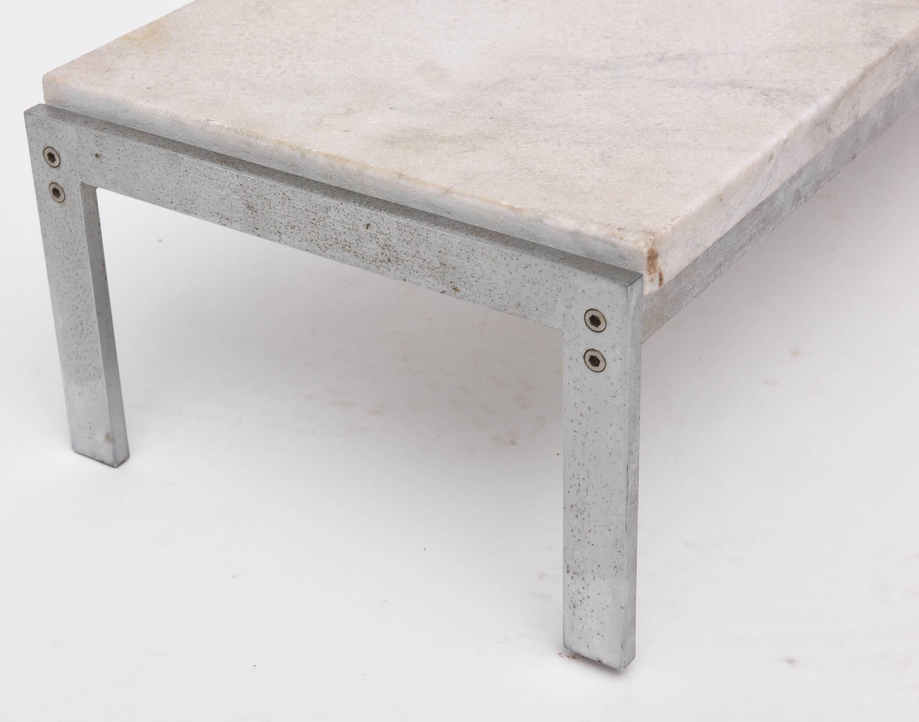 A rare example designed by Poul Kjærholm incorporating steel and cippolino marble.
Manufactured by Kold Christensen.
 