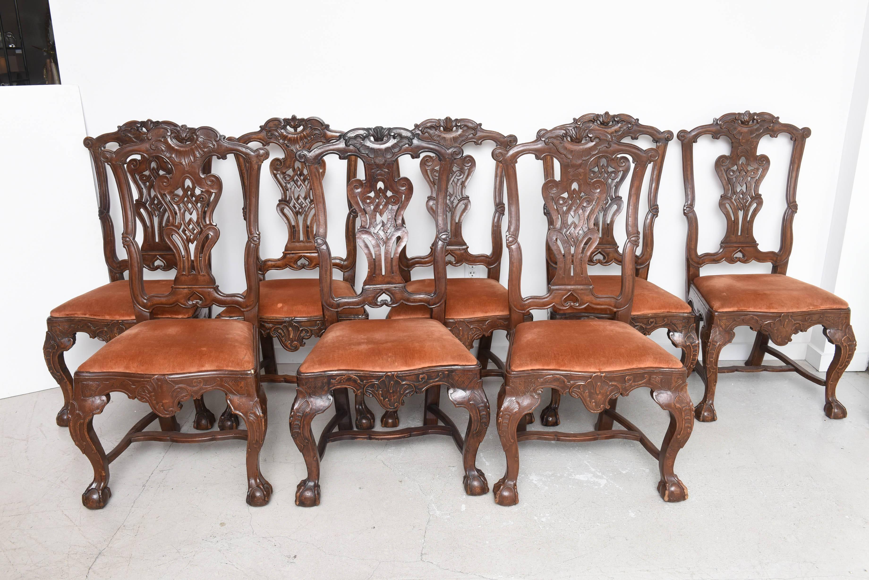 Set of dining chairs with russet colored Scalamandre velvet seats.