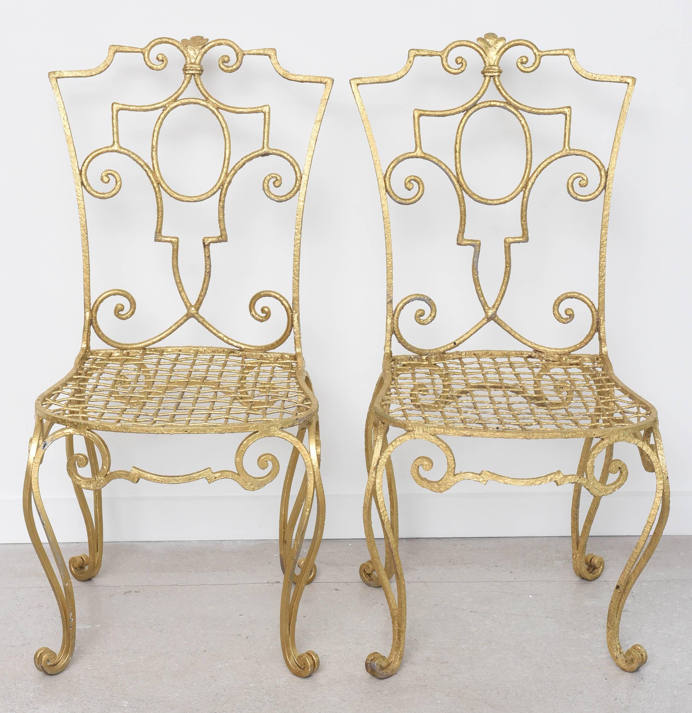 Pair of gilt metal chairs by Jean-Charles Moreux.