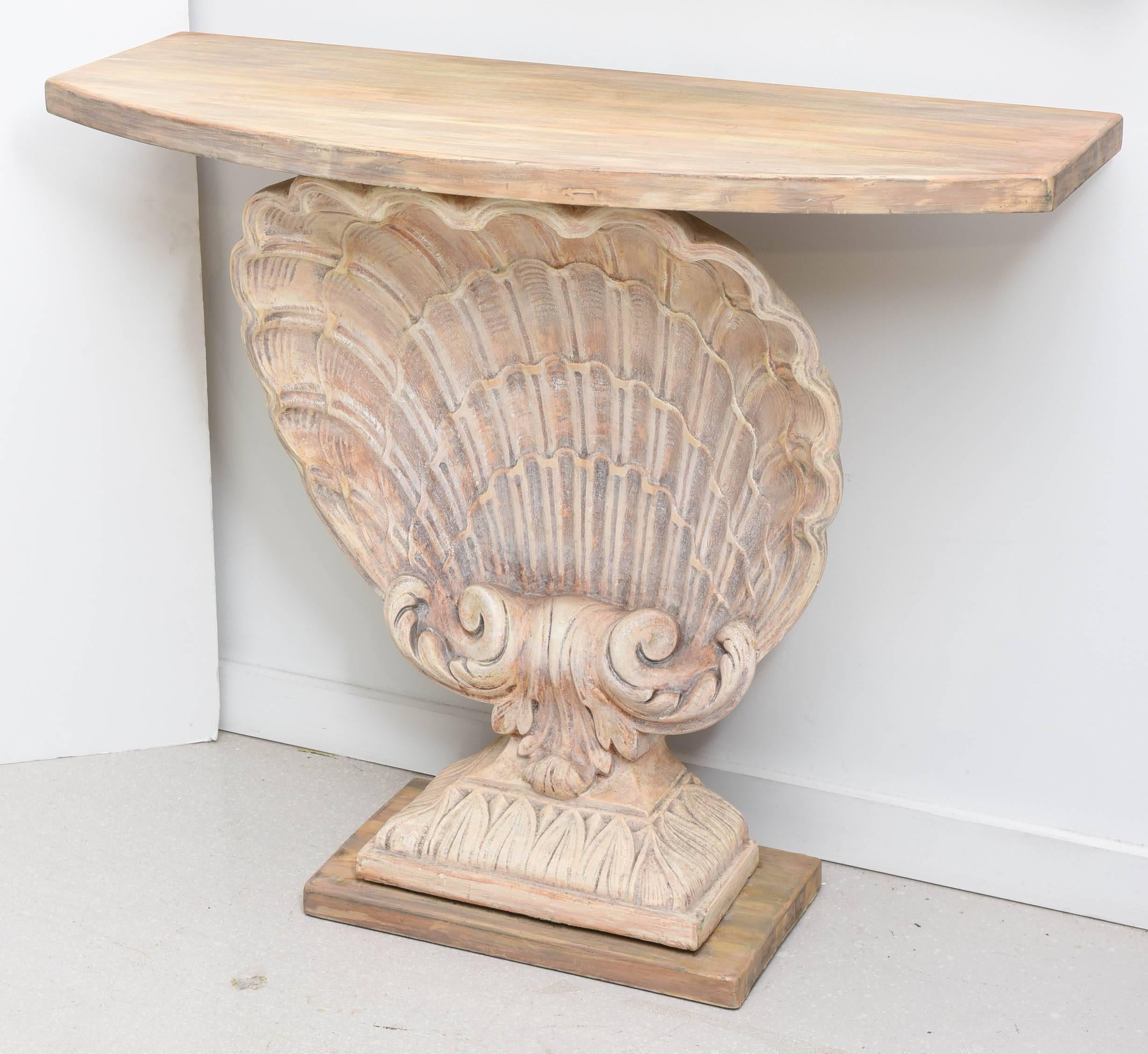 Classic carved and painted scallop shell console table.