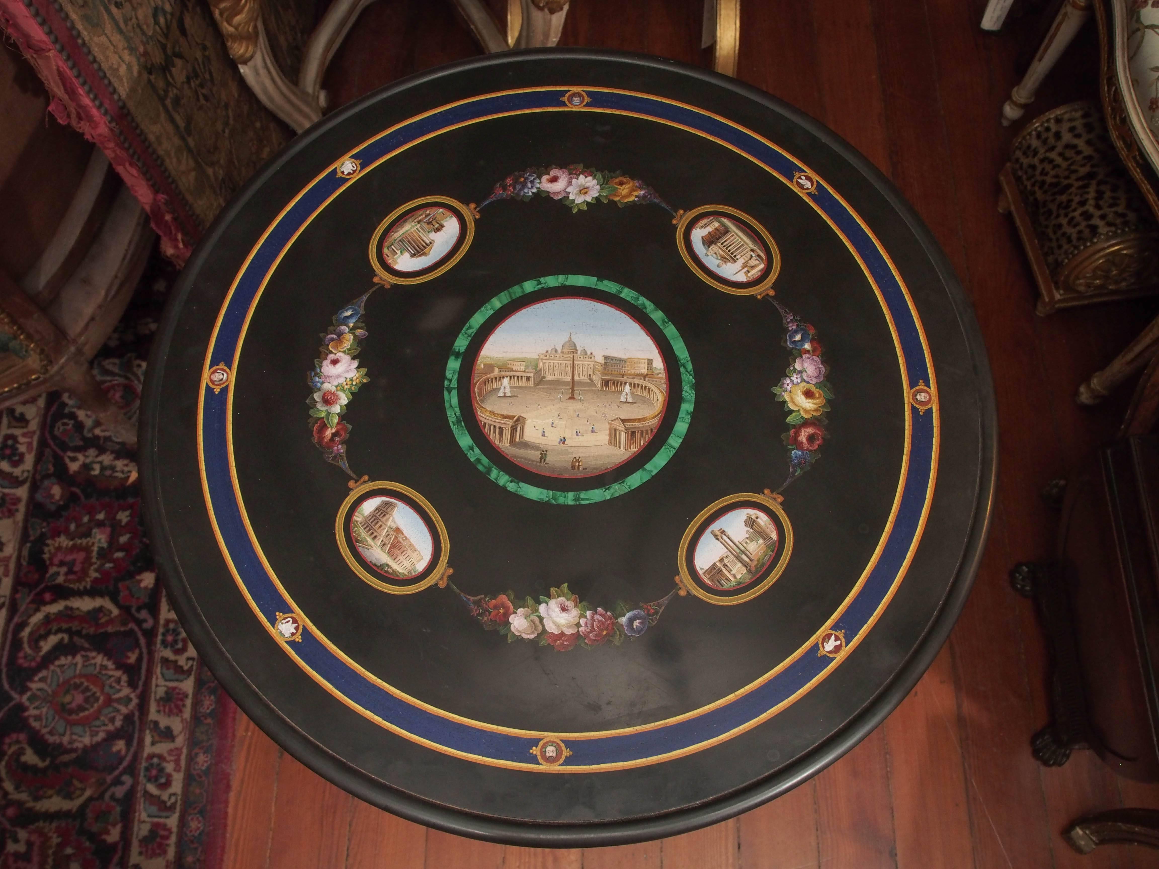 19th century Italian Micro Mosaic table with five scenes. Central scene is Saint Peters Basilica surrounded by a malachite band and four surrounding of The Collosseum, The Forum, The Pantheon and The Temple of Hercules the victor all connected by