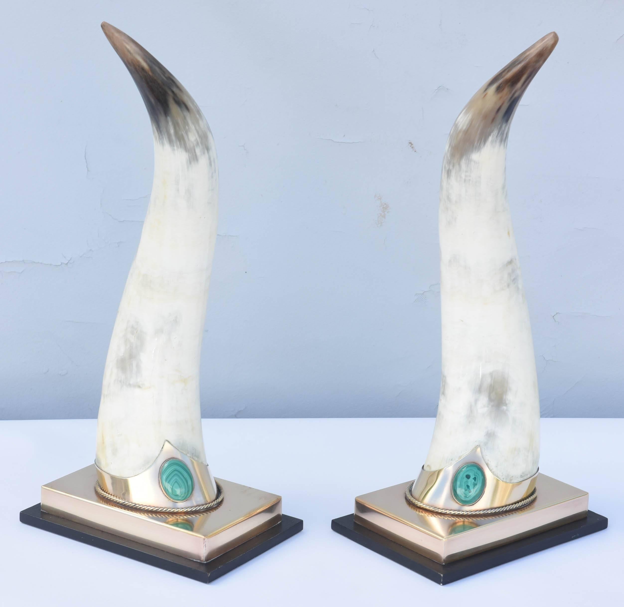 Exceptional pair of one-of-a-kind, mounted, bull horns, in brass collars, adorned with malachite, on graduating rectangular base. Impressed mark 
