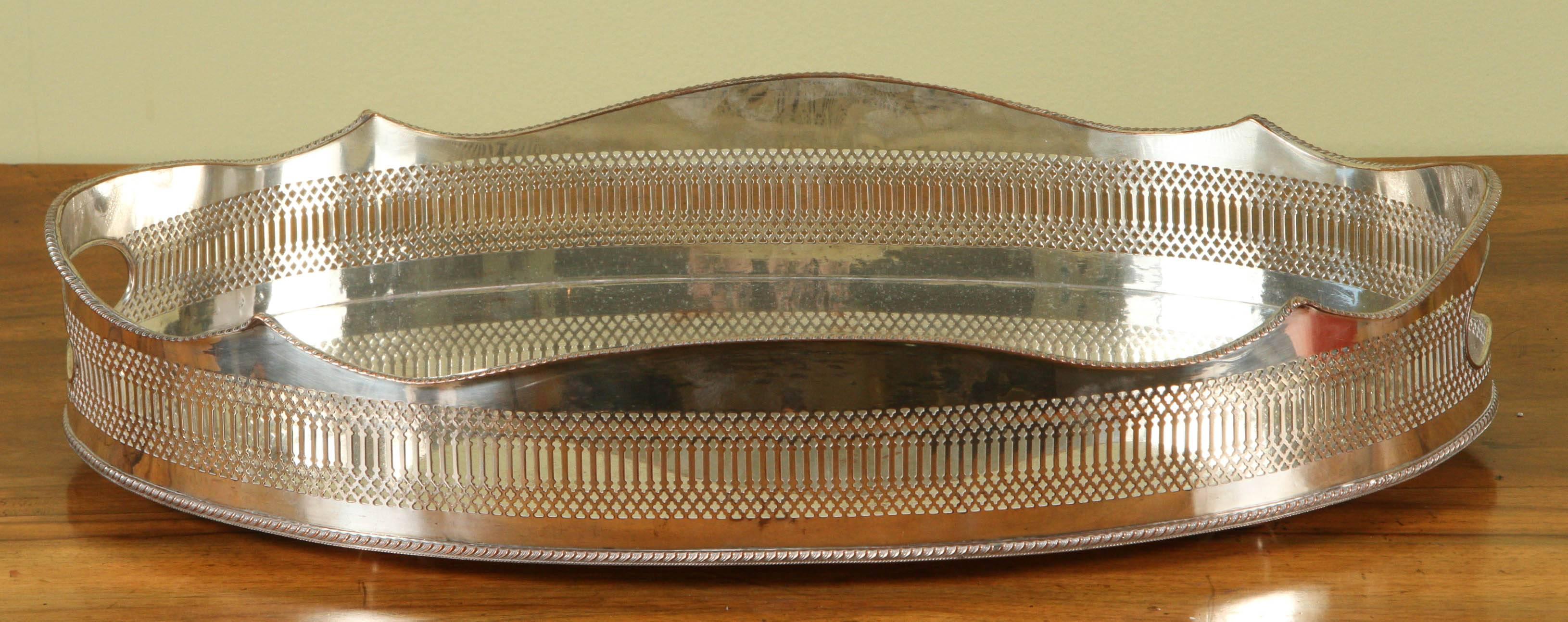 A large oval early Sheffield gallery tray with hand-cut outs.