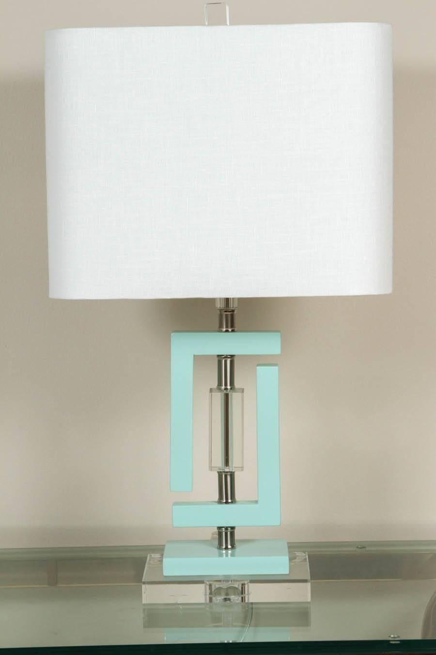 With a Lucite base and seafoam details, this lamp adds the perfect touch of minimalism to any room. These pieces will grab your attention instantly and brighten up the space.