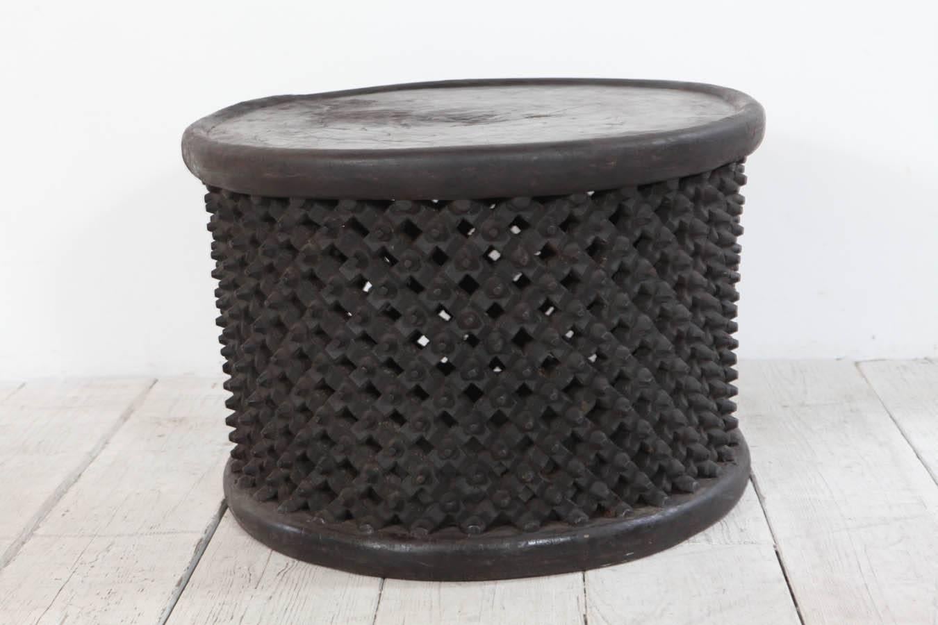 Classic African drum table with carved apron.