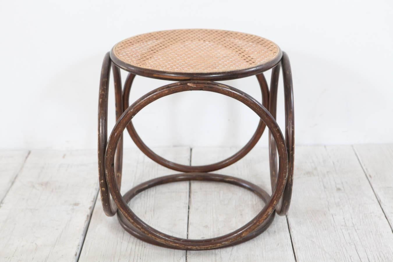 Geometric circular stool / occasional table with cane top.