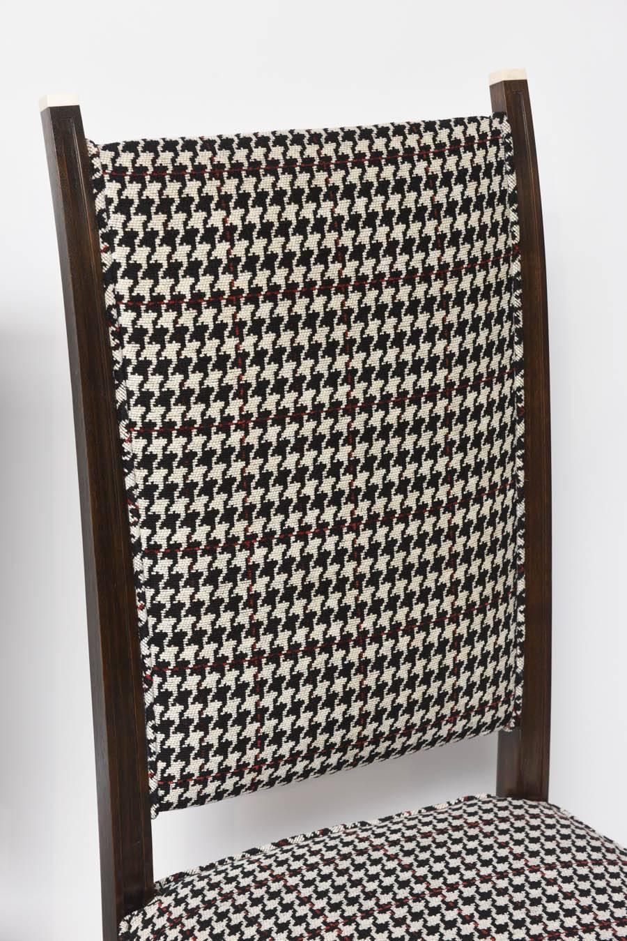 All original vintage pair of chairs with bone detail finials to backrest. Newly upholstered woven wool houndstooth over dark mahogany. Just stunning!

Note: These will ship from our Miami showroom.