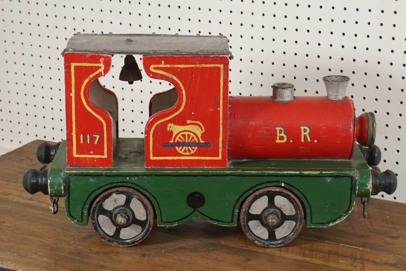 Painted porch has a very large collection of children's toys, particularly toy trains. This one is unique. It is a circus train, complete with a bell on the inside and everything is original. These toys are handmade and were likely put together by a